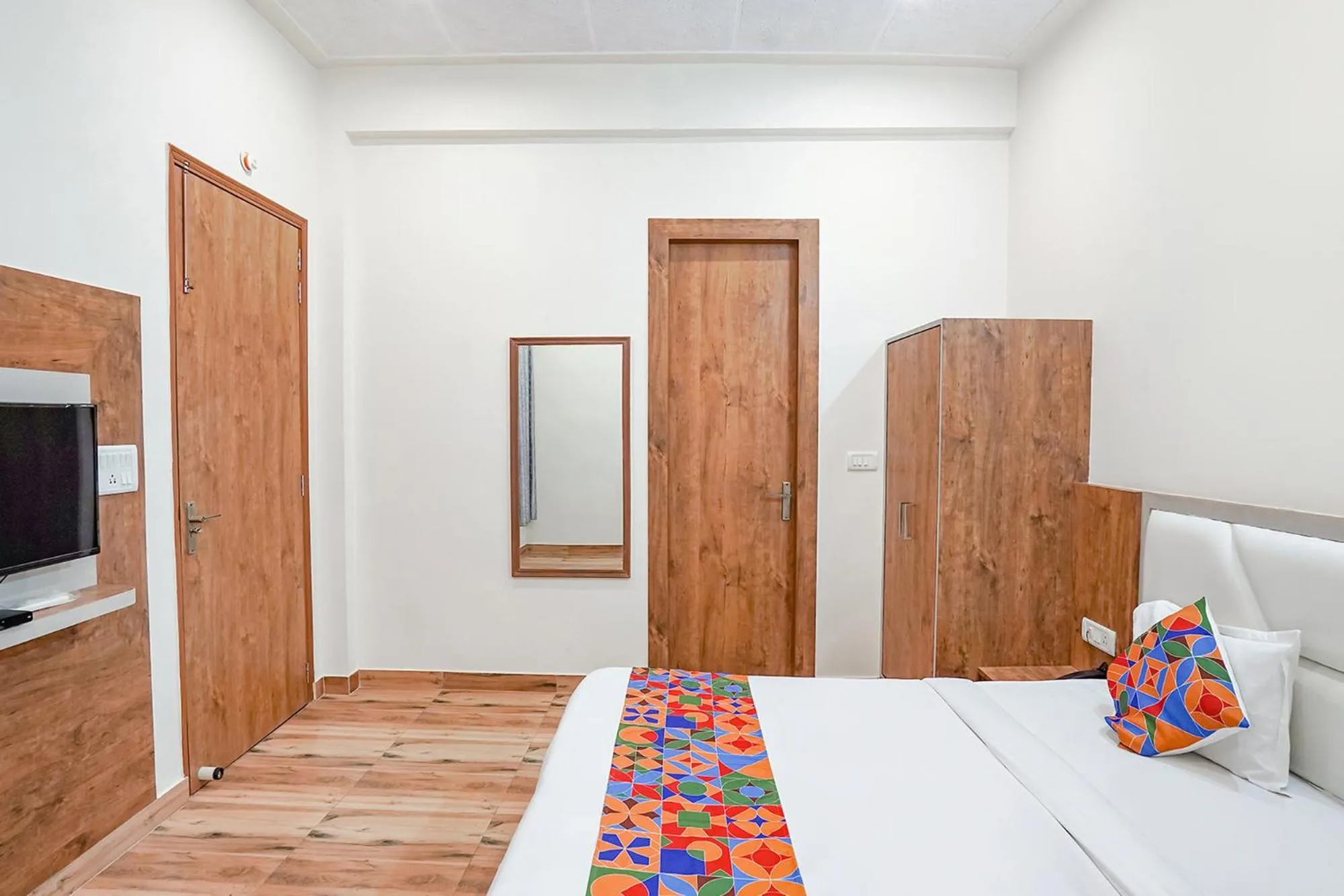 Bed in FabHotel Sirtaj Suits