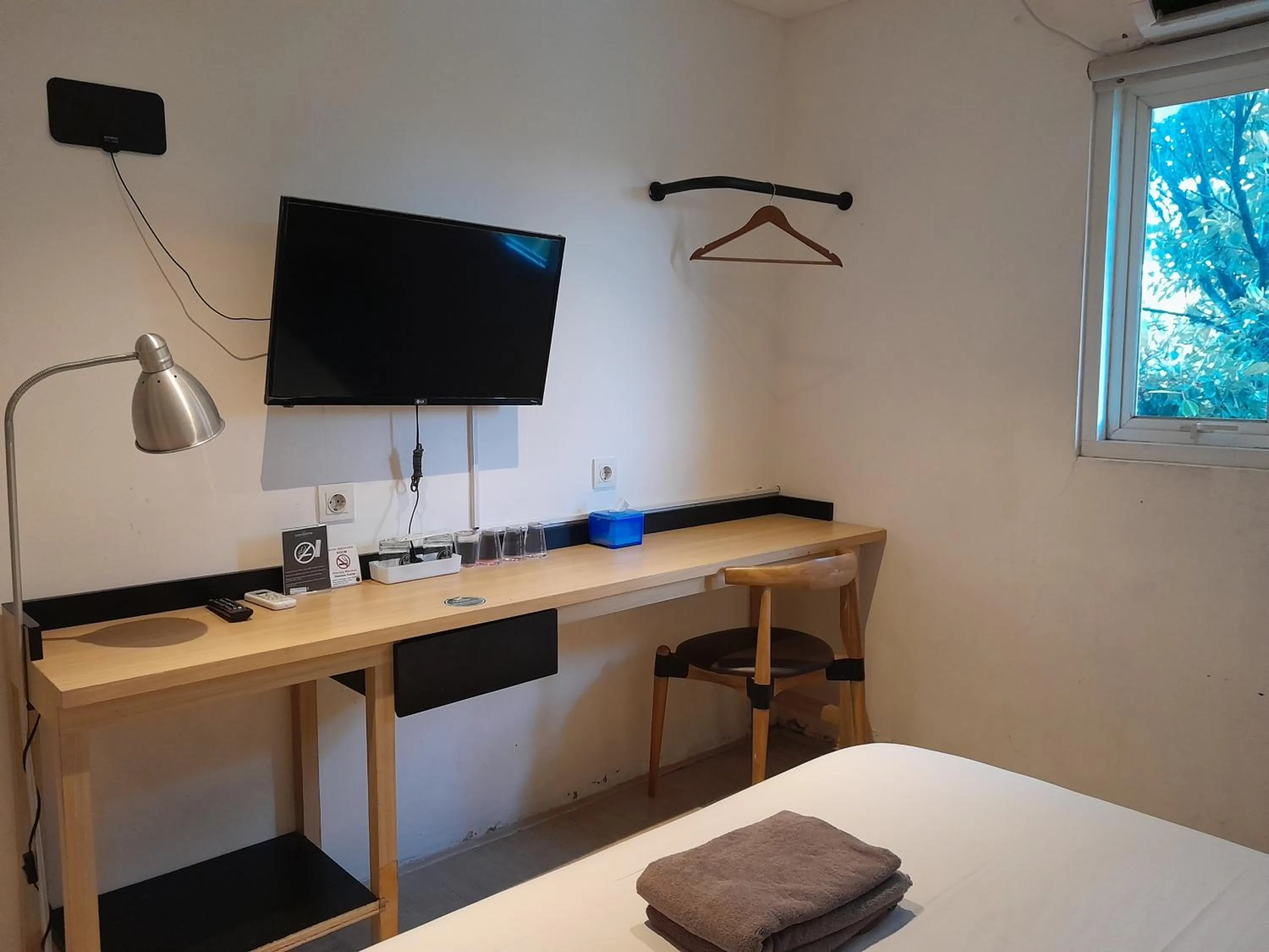 Bed in The Green Winotosastro Hotel Yogyakarta