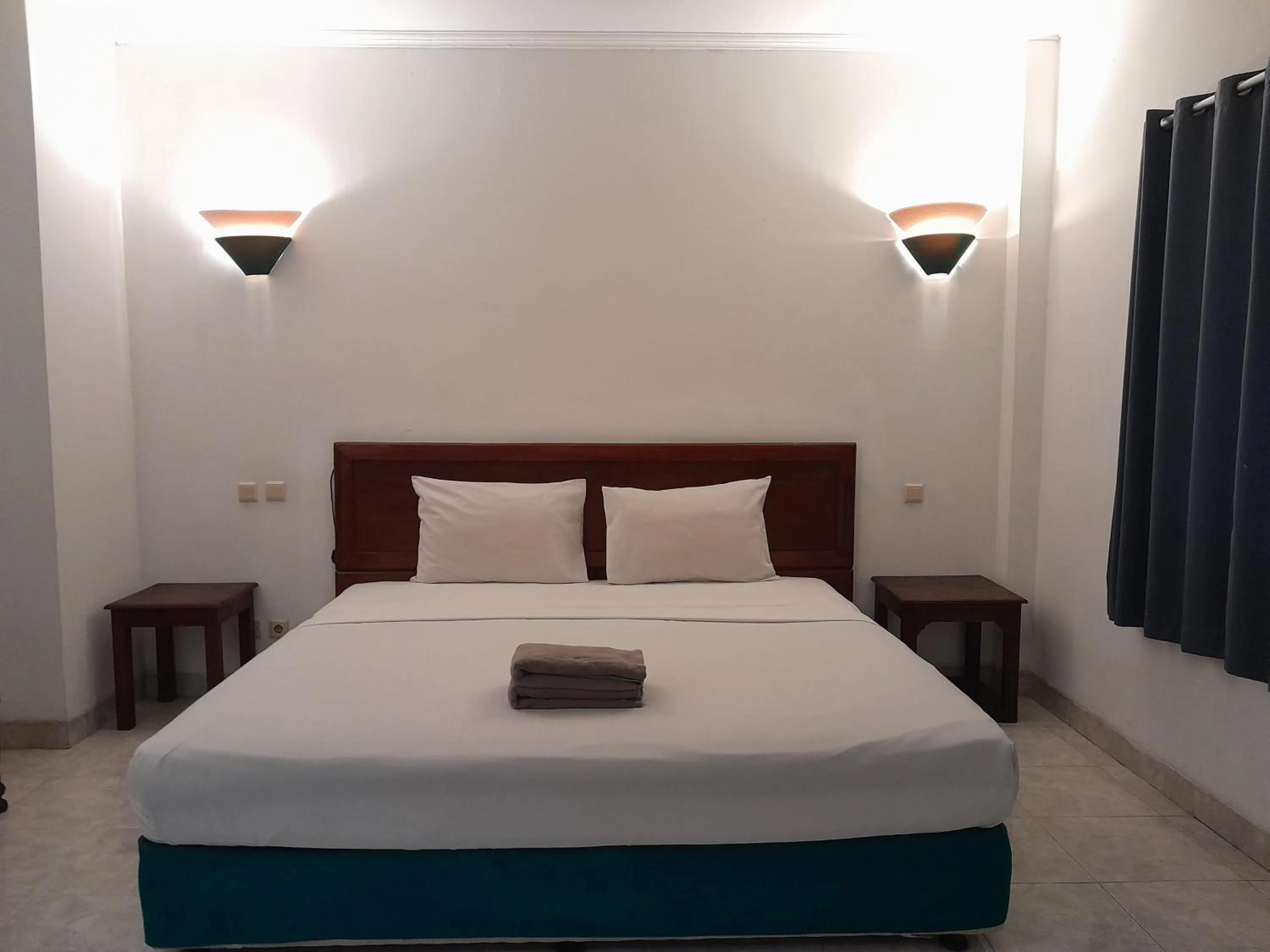 Bed in The Green Winotosastro Hotel Yogyakarta