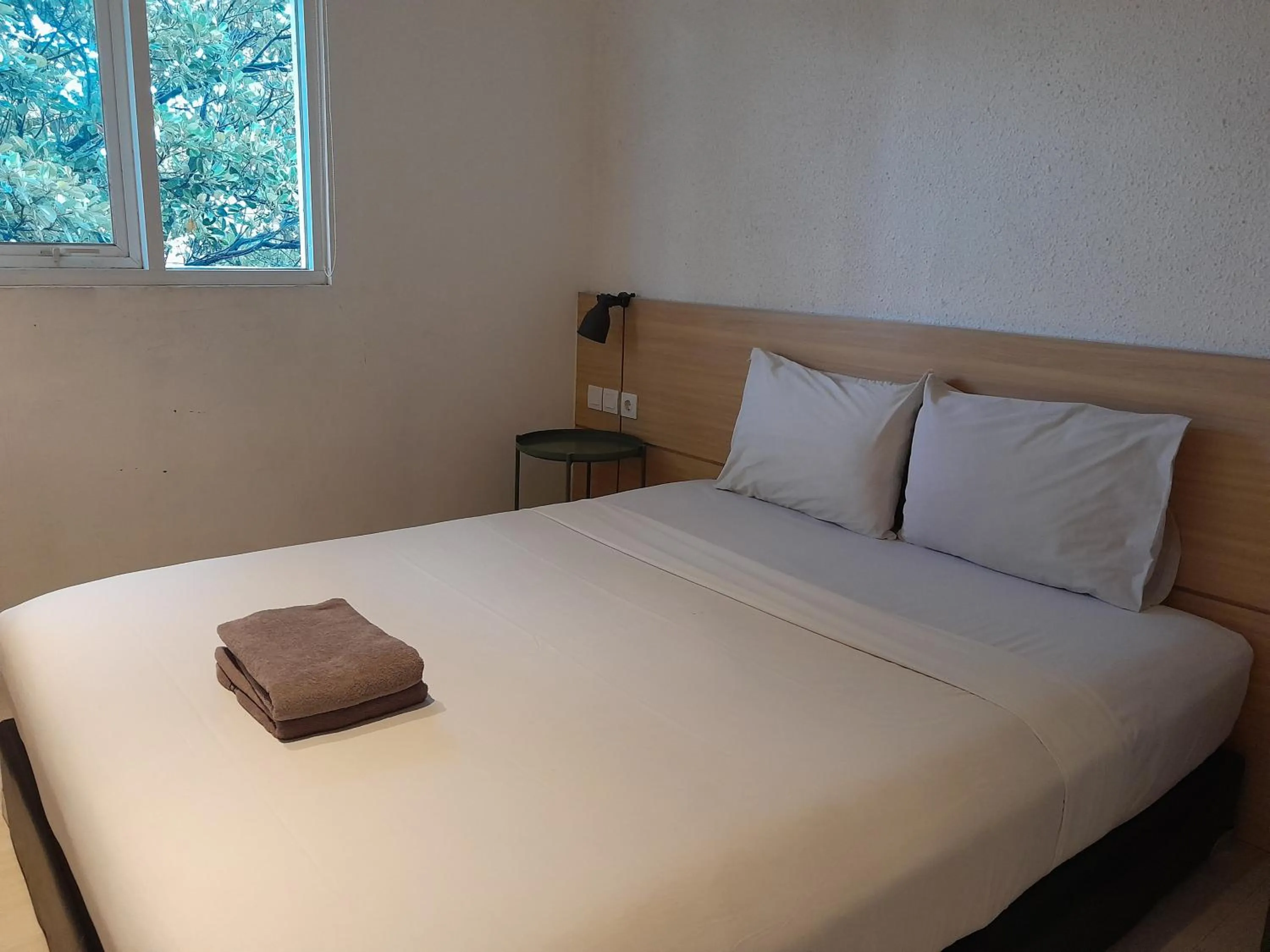 Bed in The Green Winotosastro Hotel Yogyakarta