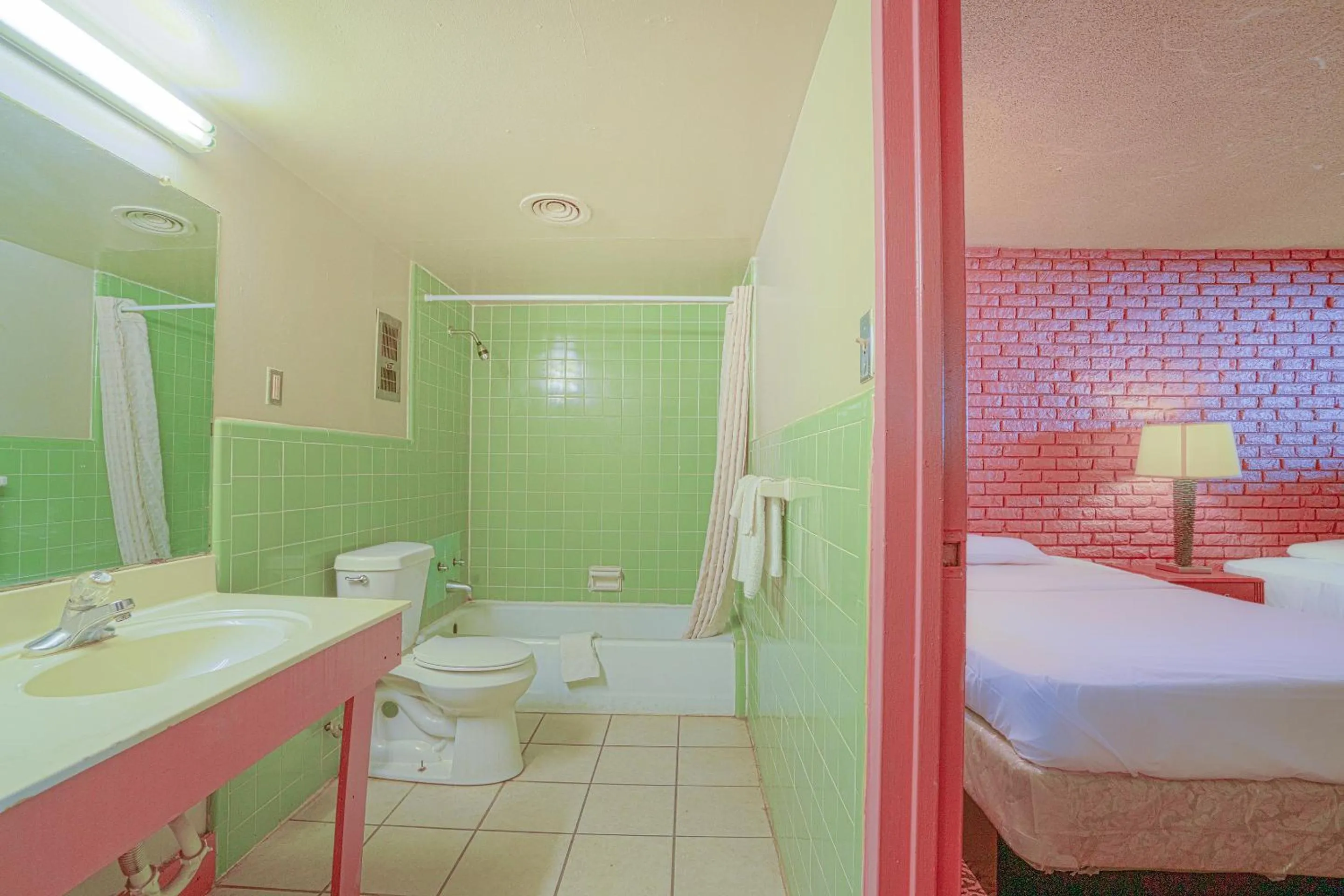 Bathroom in Town & Country Motel Bossier City by OYO