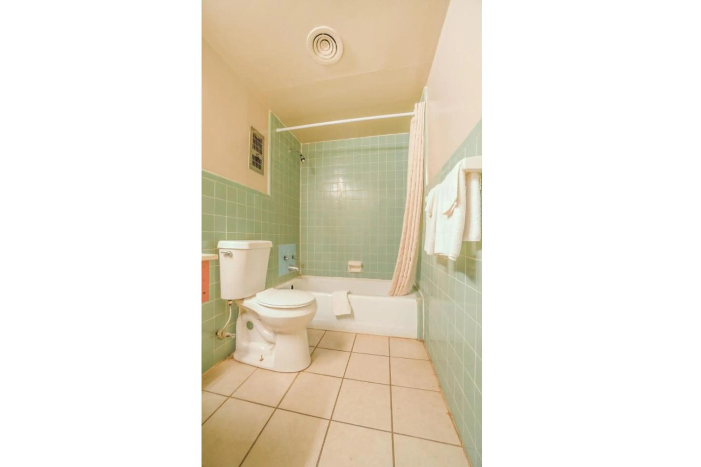Bathroom in Town & Country Motel Bossier City by OYO