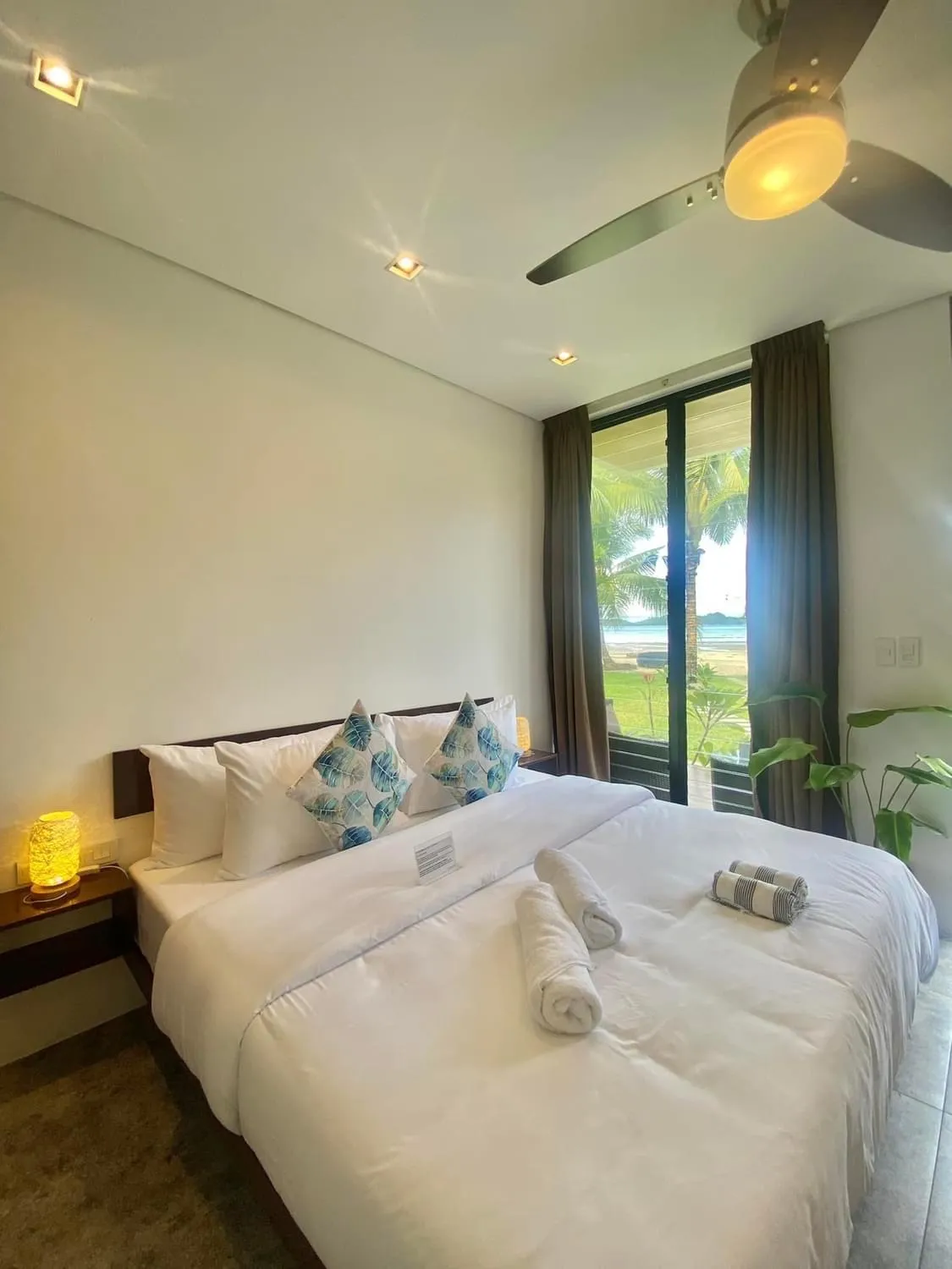 Bed in Amila Dive Beach Resort