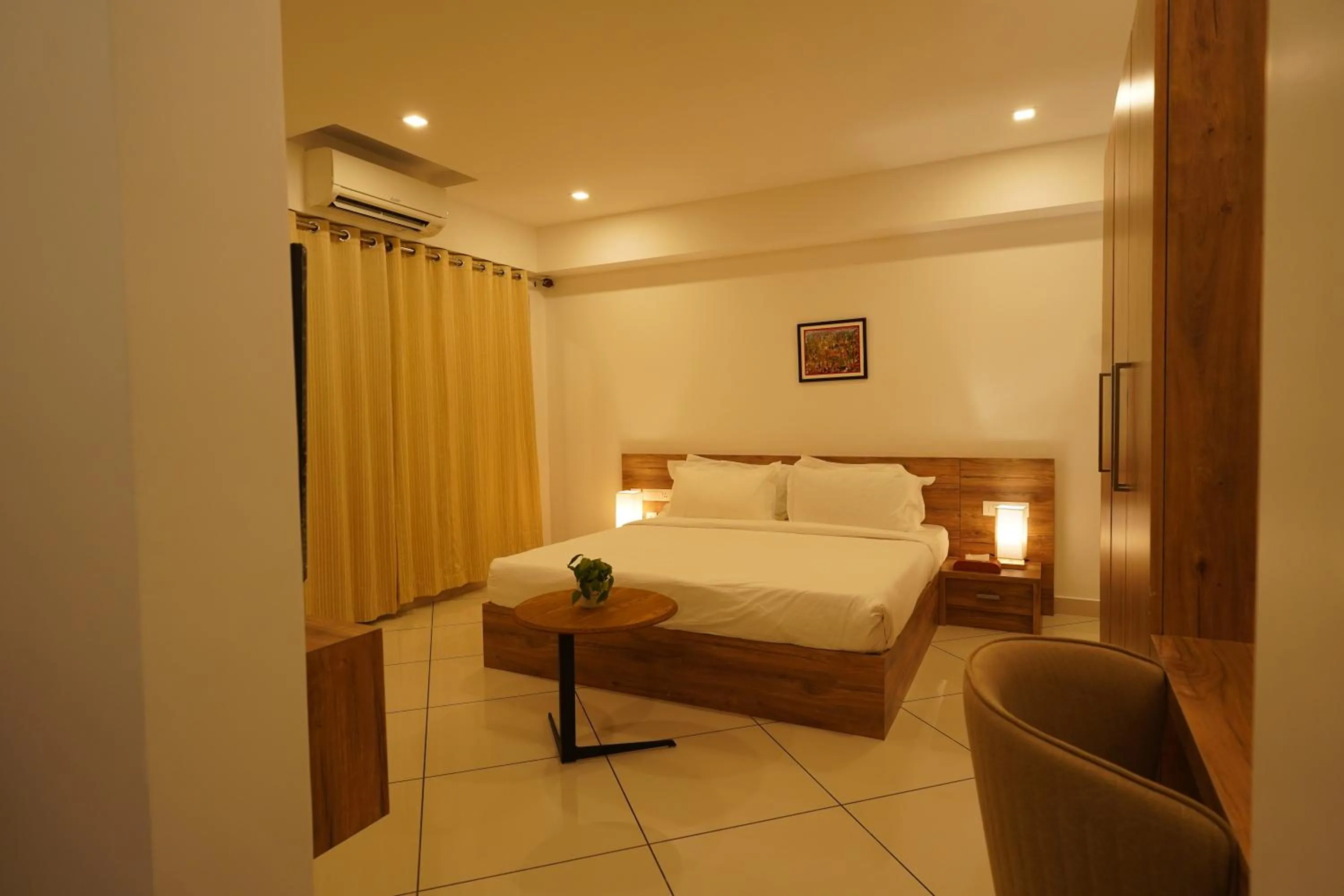 Photo of the whole room, Bed in Tea Tree Suites,Manipal