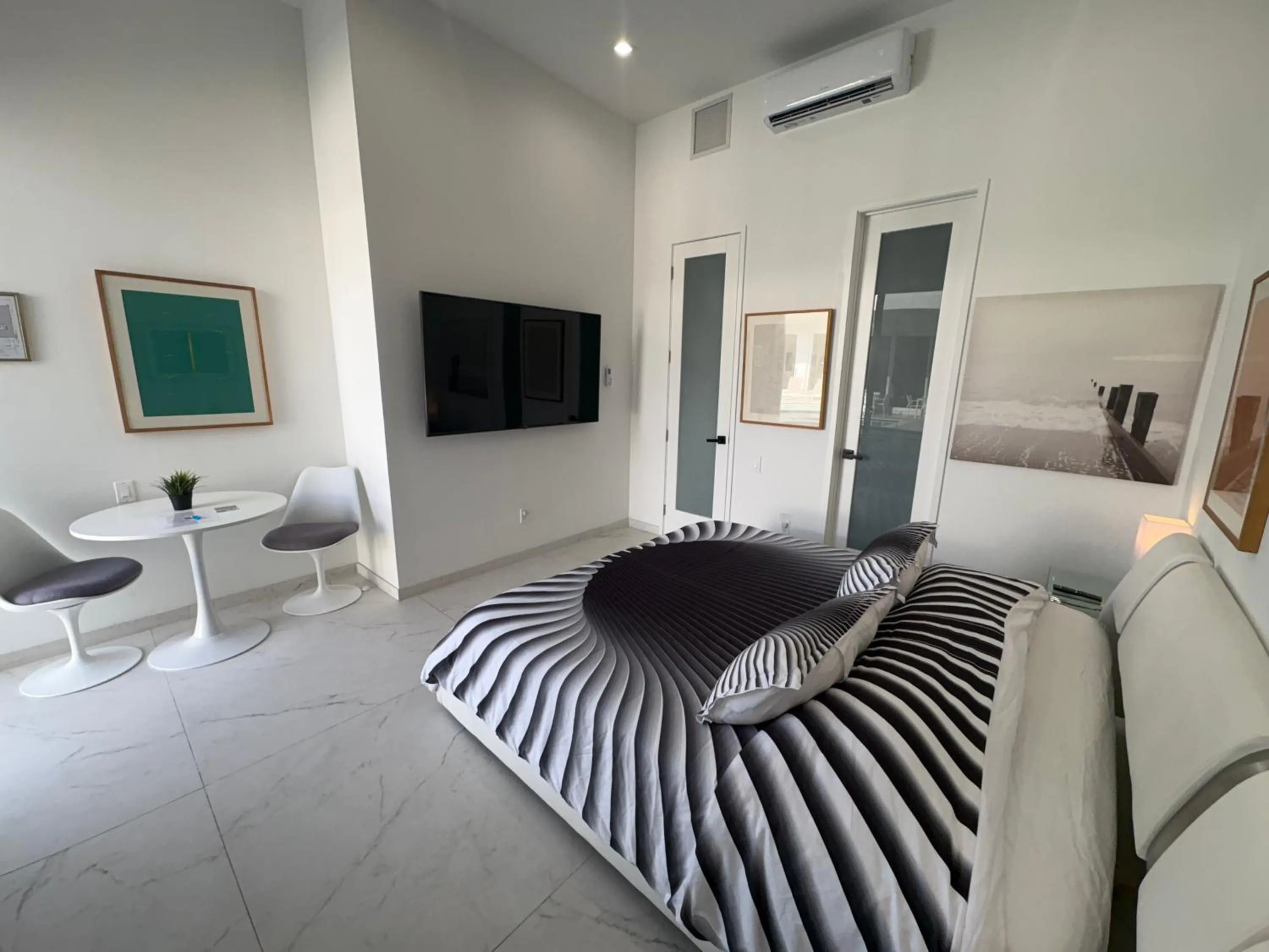 Bed in Men only clothing option guesthouse near Wilton Manors