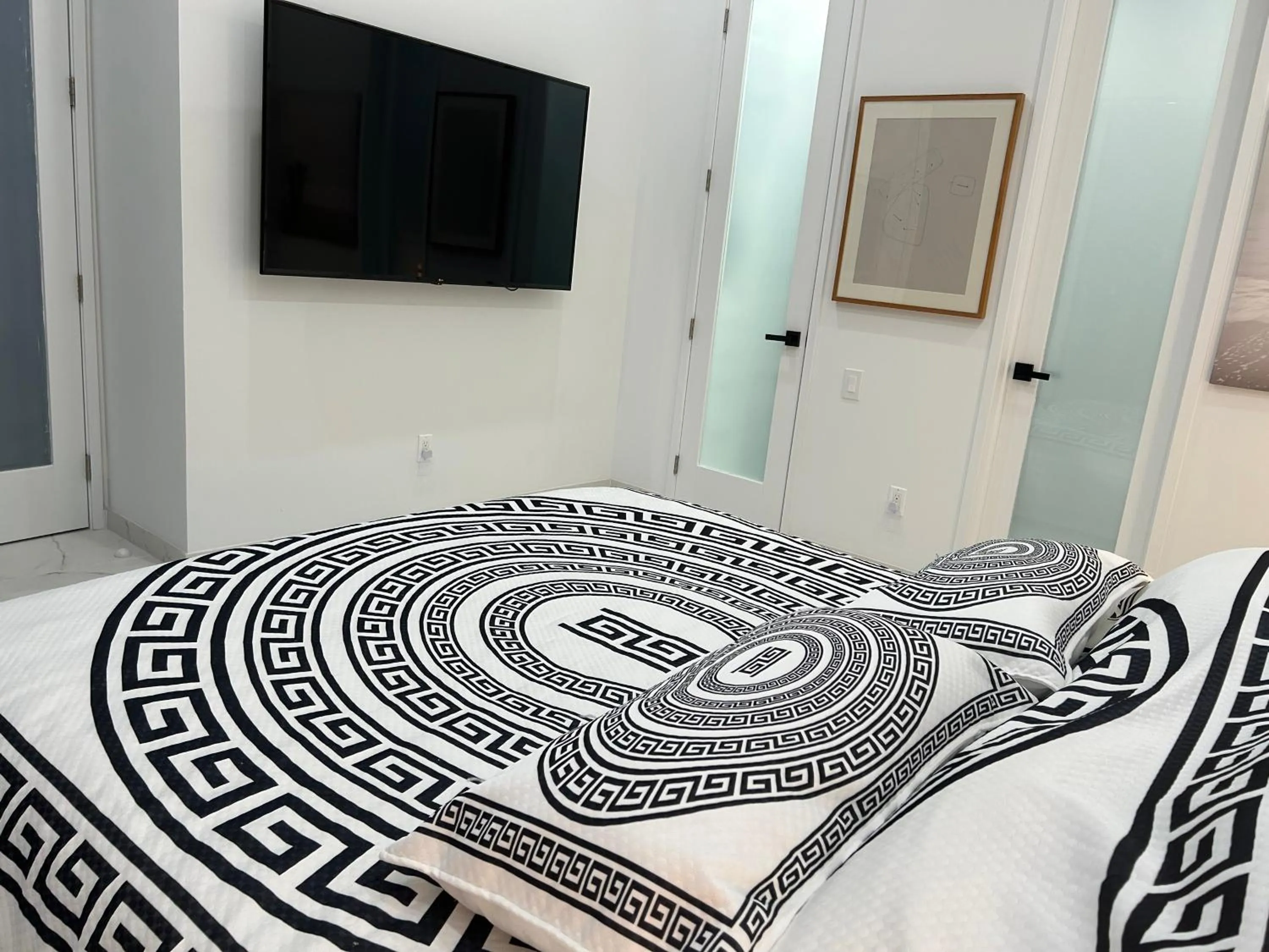 Bed in Men only clothing option guesthouse near Wilton Manors