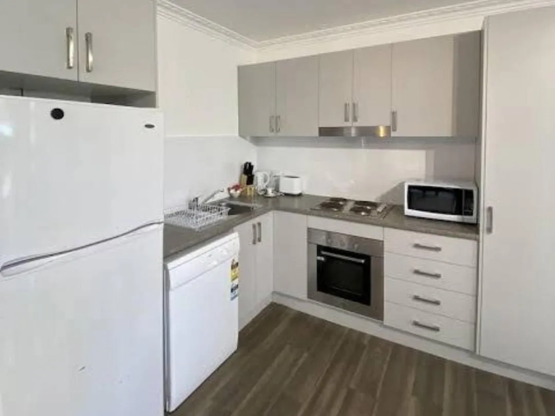 Kitchen or kitchenette in Beach Park Motel