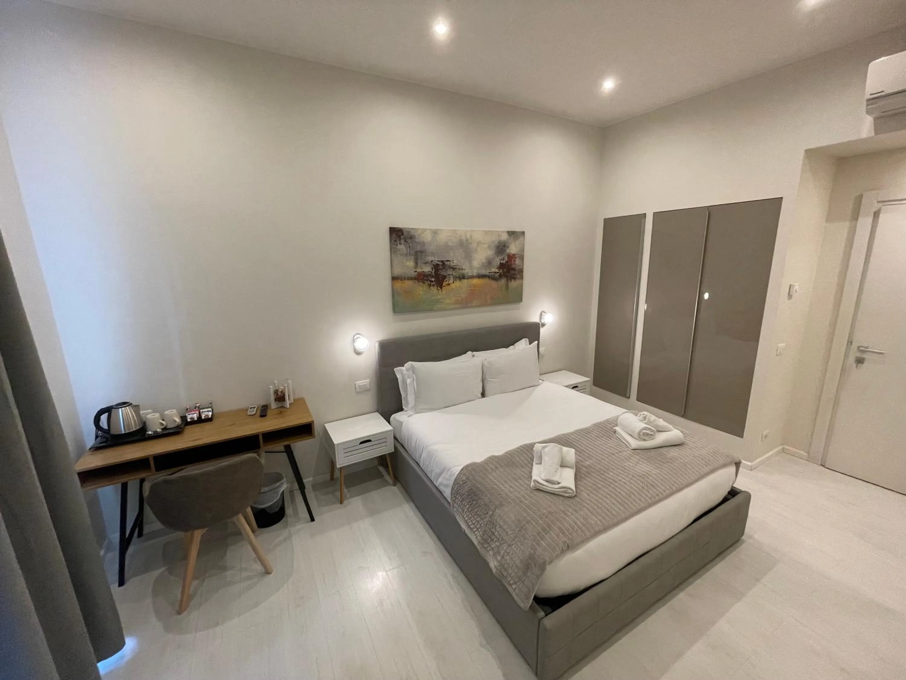 Bed in Quintus Luxury Suites