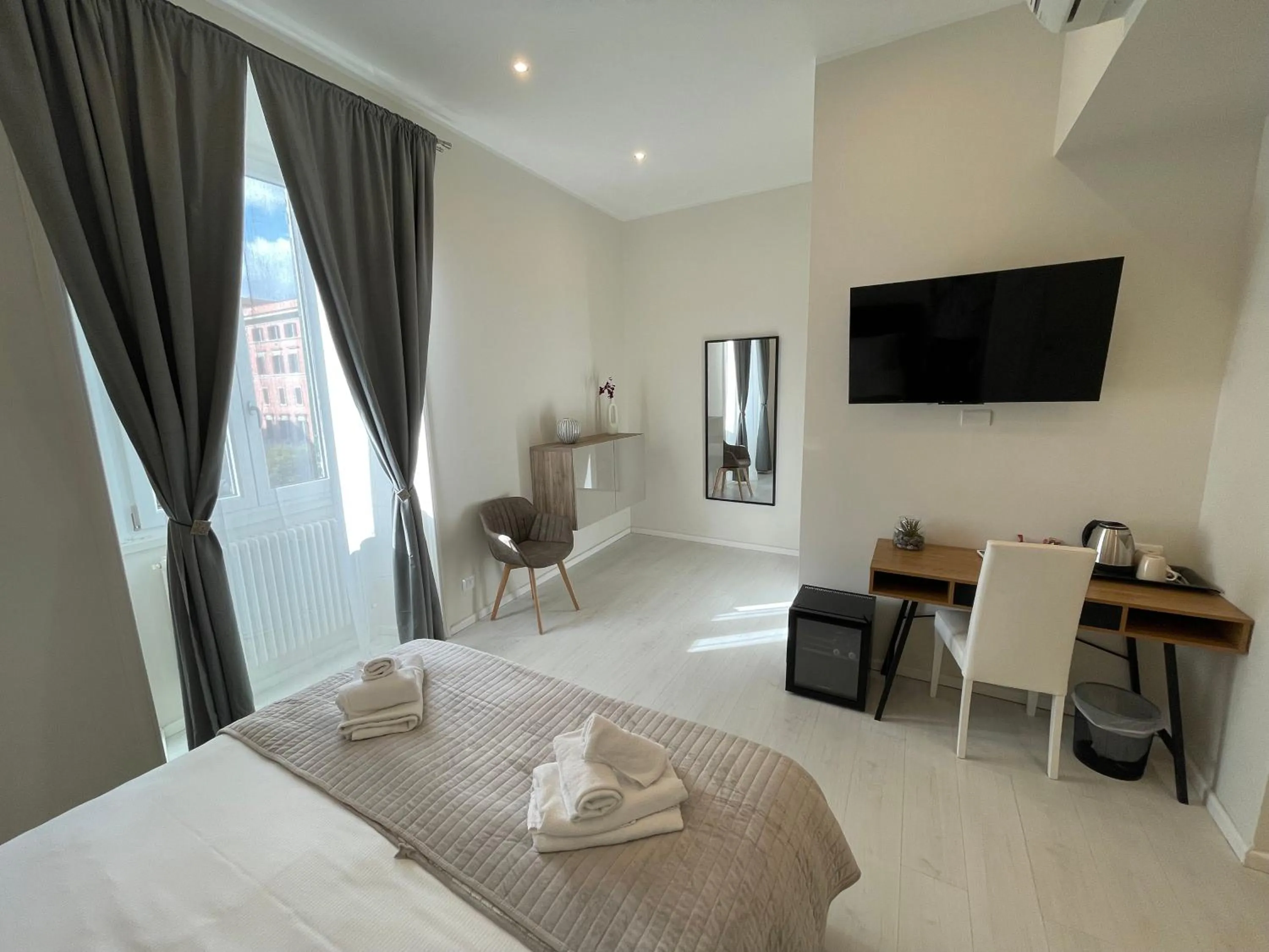 Bed in Quintus Luxury Suites