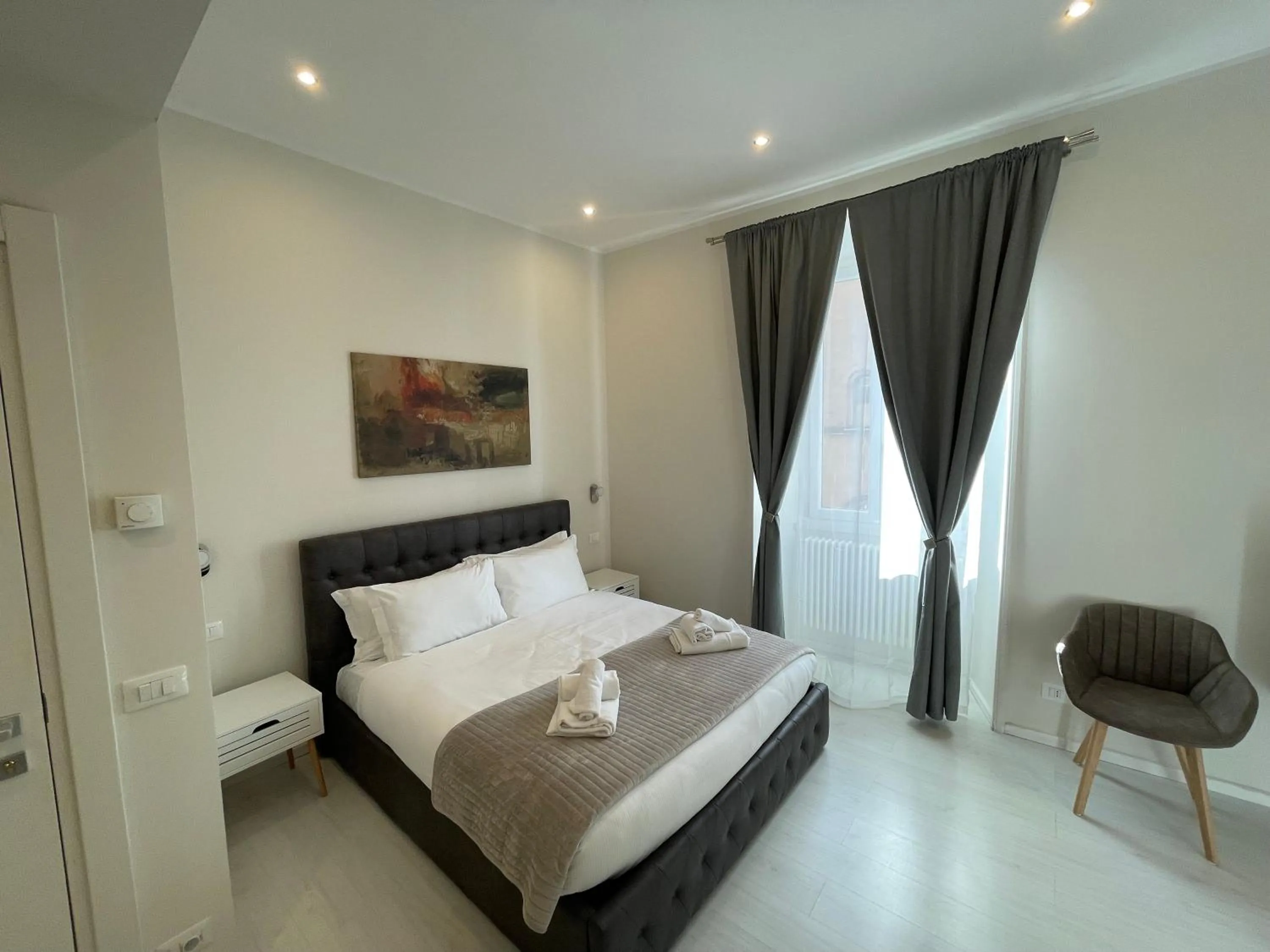 Bed in Quintus Luxury Suites