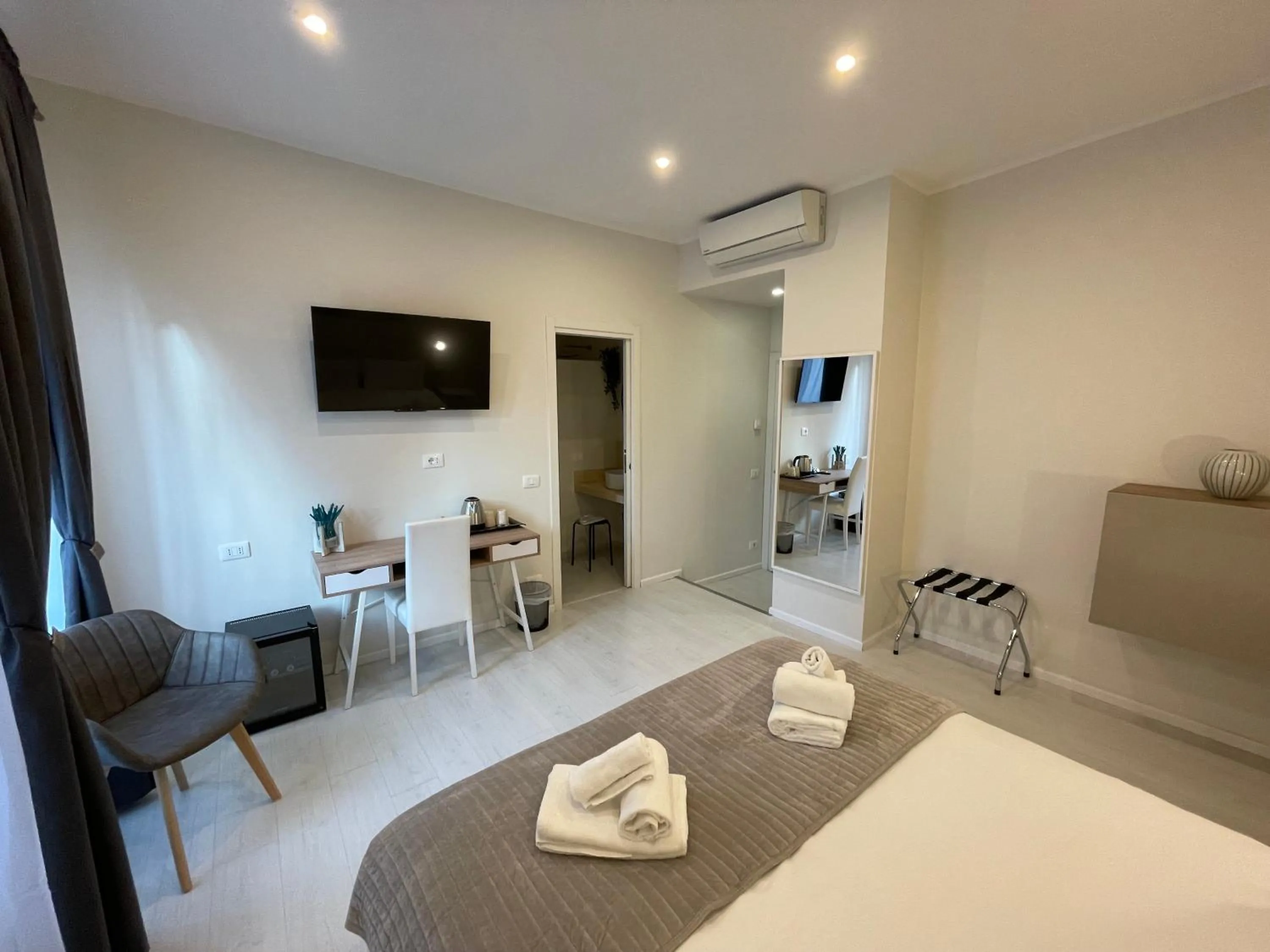 Bed in Quintus Luxury Suites