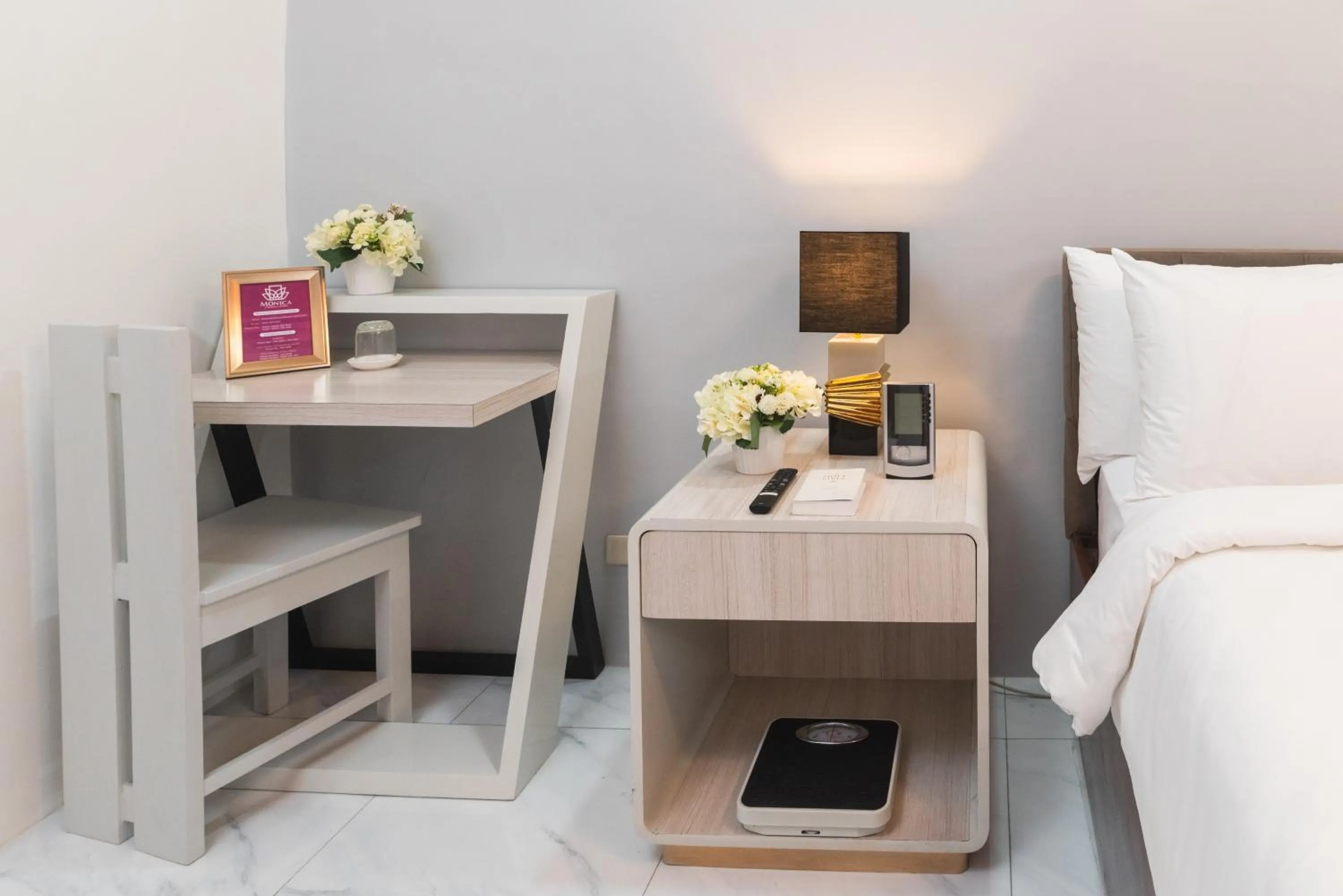 Bed in Monica Midtown Suites