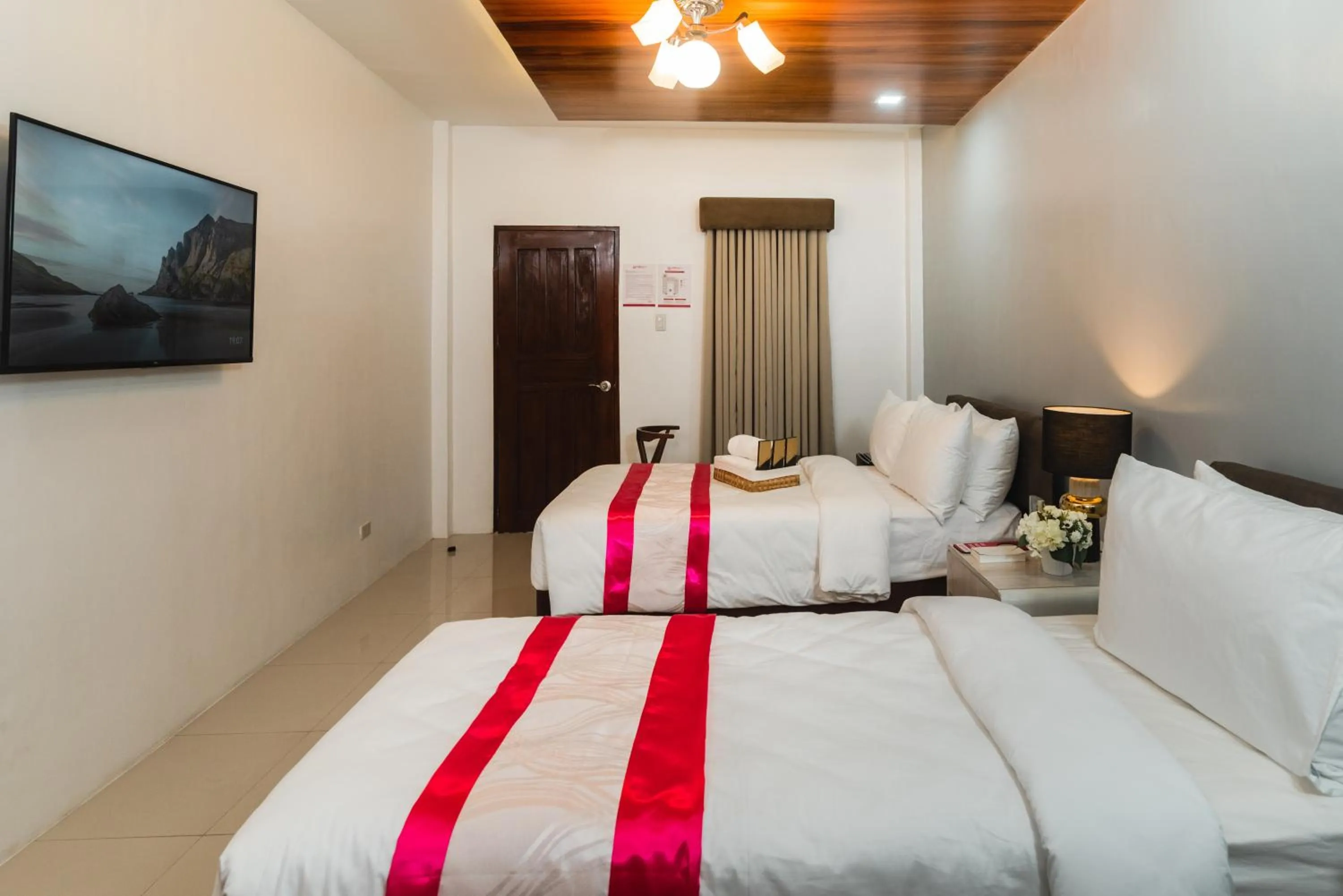 Bed in Monica Midtown Suites