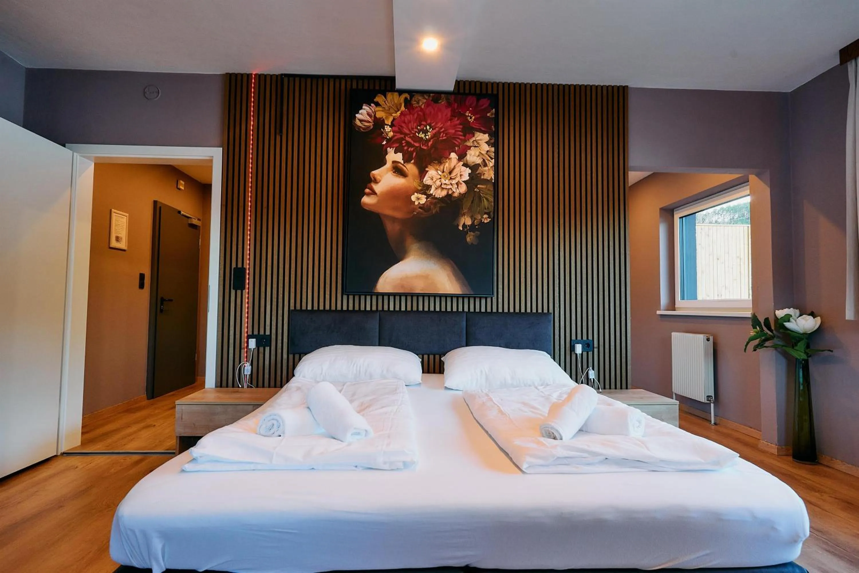 Bed in The Art and Sporthotel