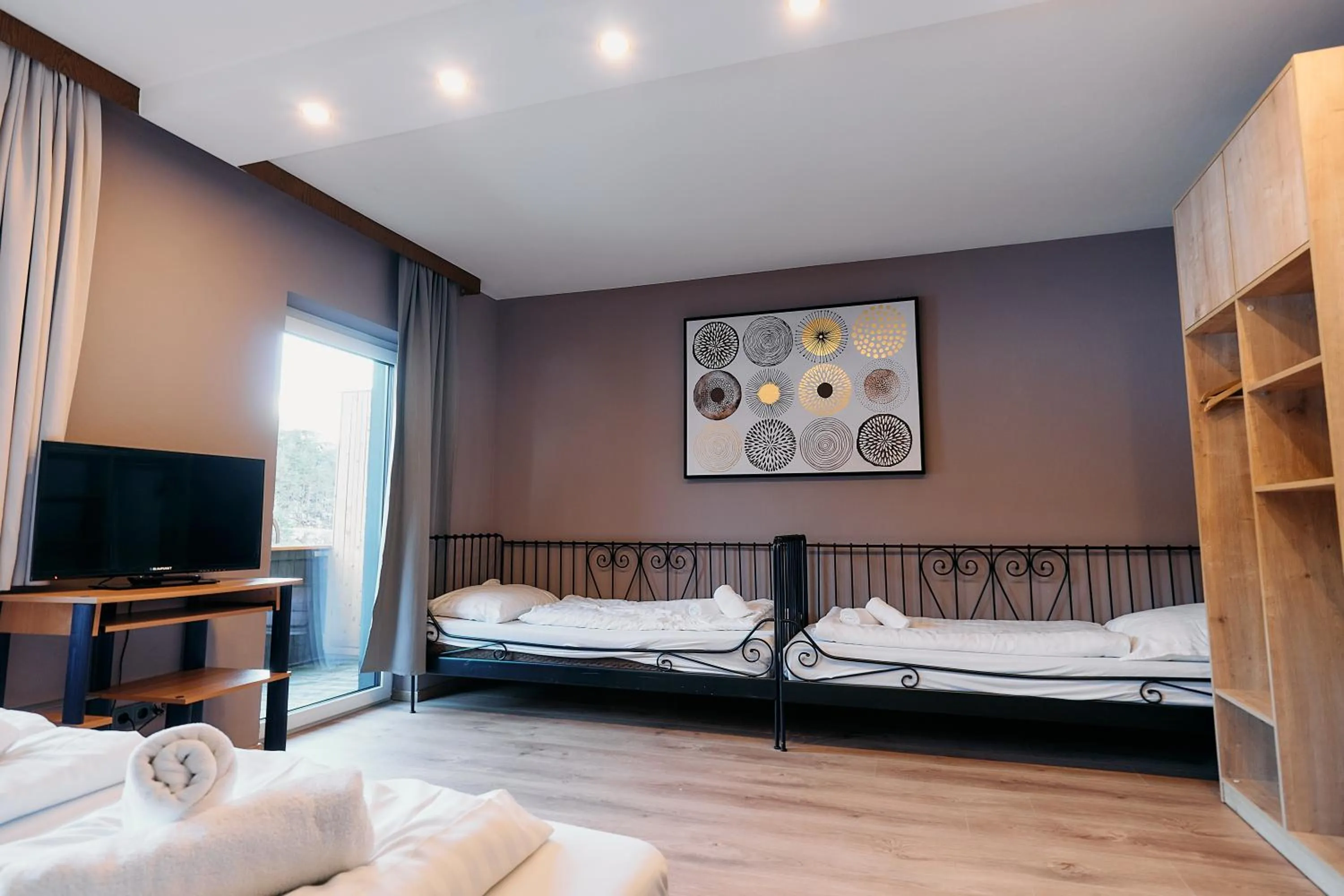 Bed in The Art and Sporthotel