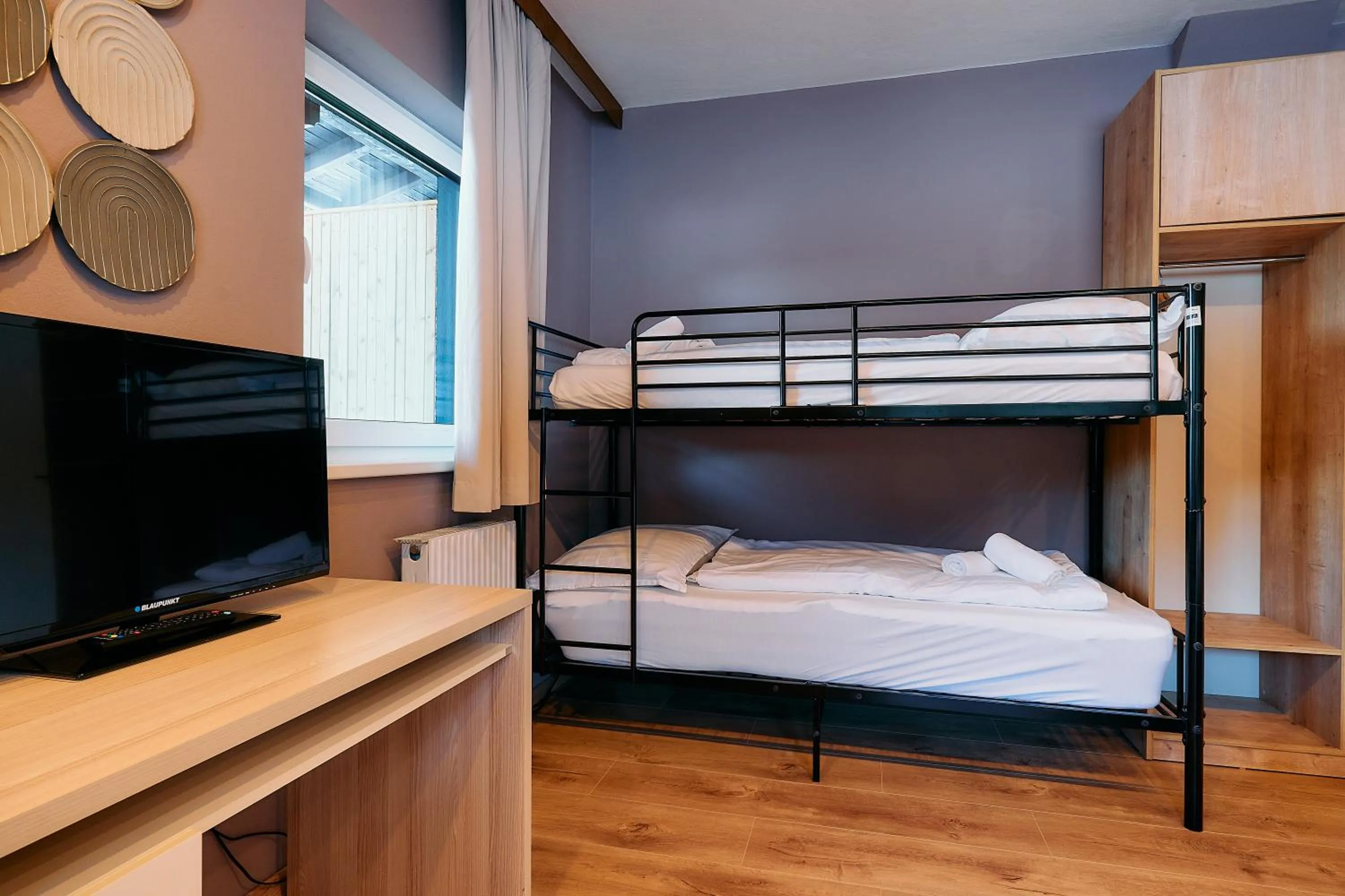 Bed in The Art and Sporthotel