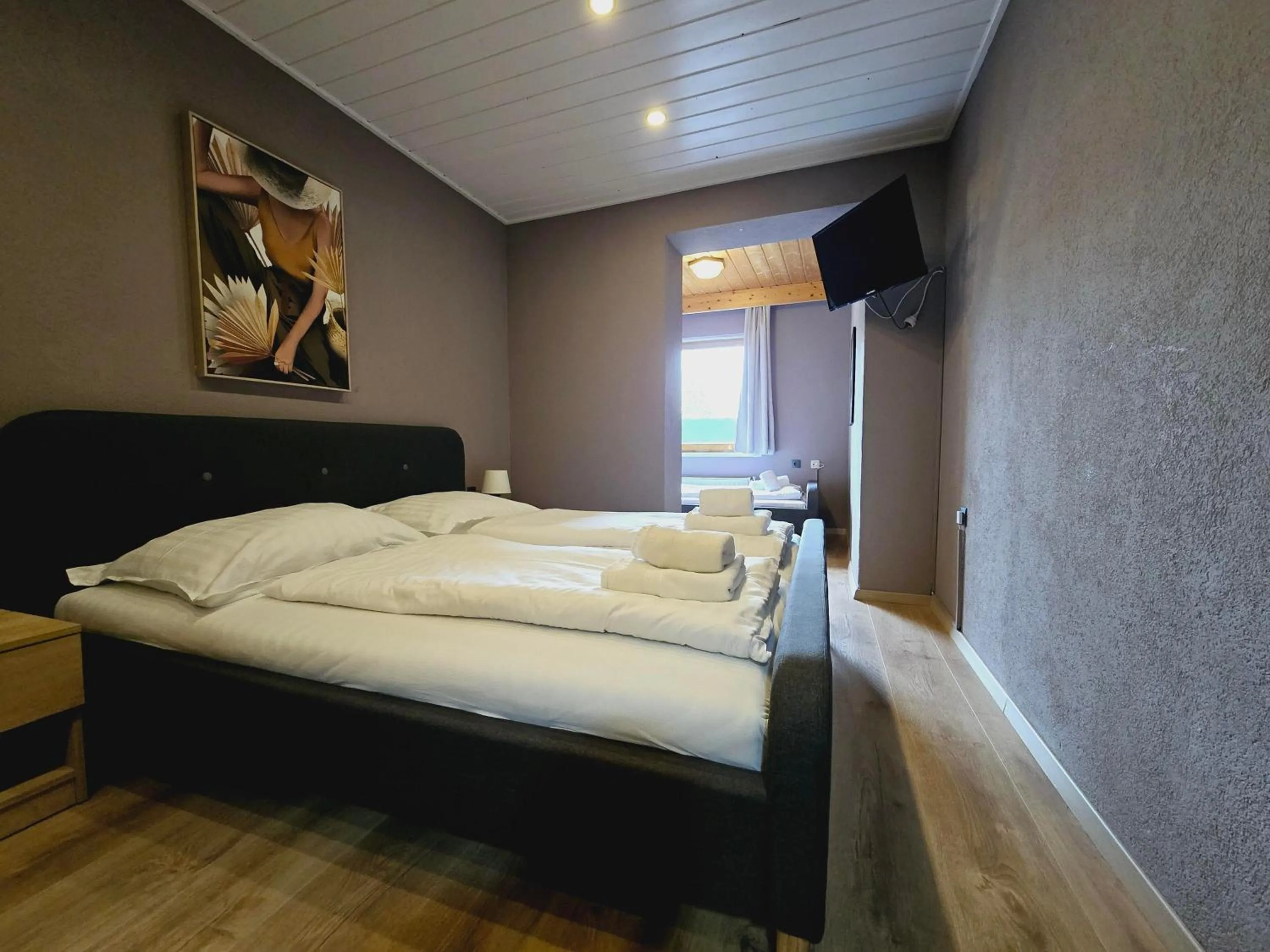 Bed in The Art and Sporthotel