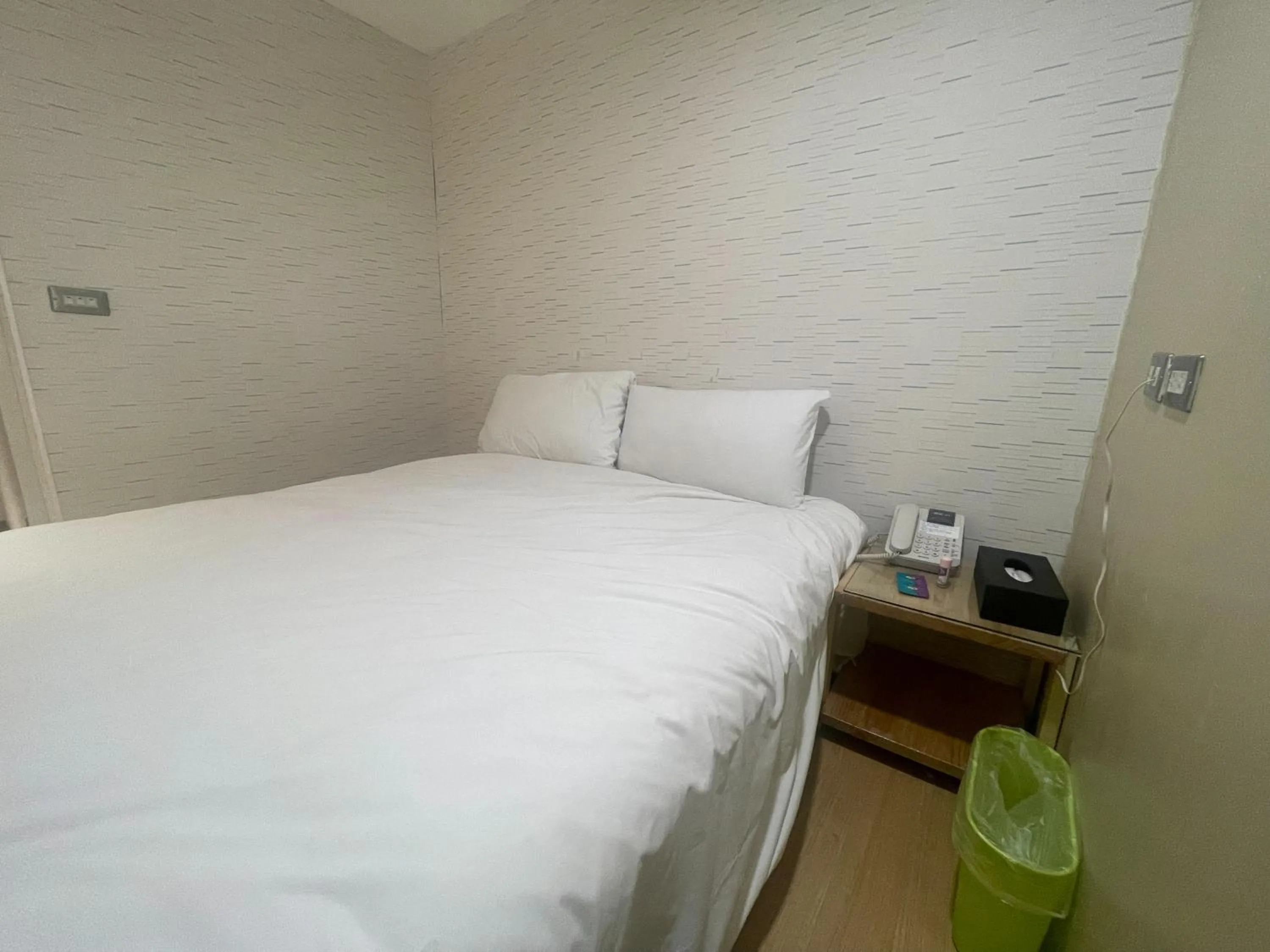 Bed in Ximenhotel-Xining西門大飯店-西寧館