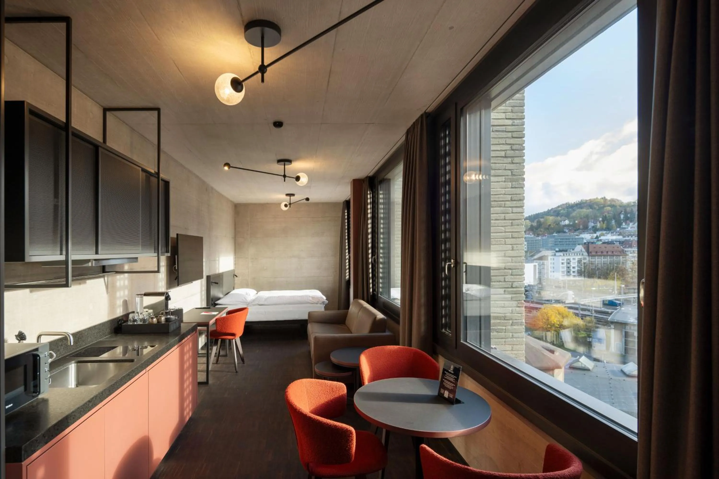 Kitchen or kitchenette in Tailormade Hotel LEO St Gallen