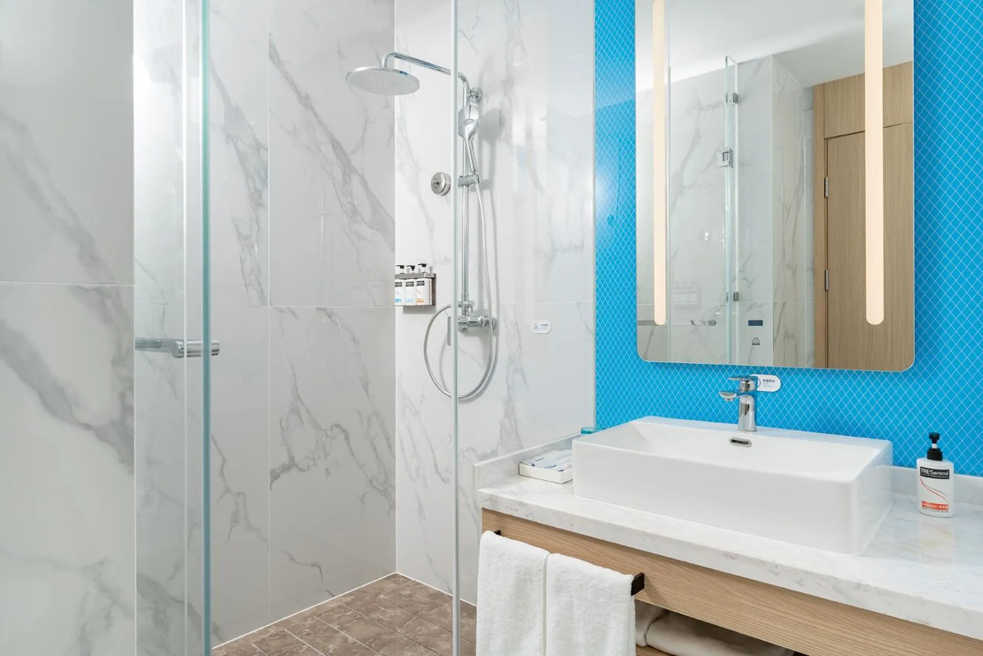 Shower in Holiday Inn Express Qingdao Northern West Coast by IHG