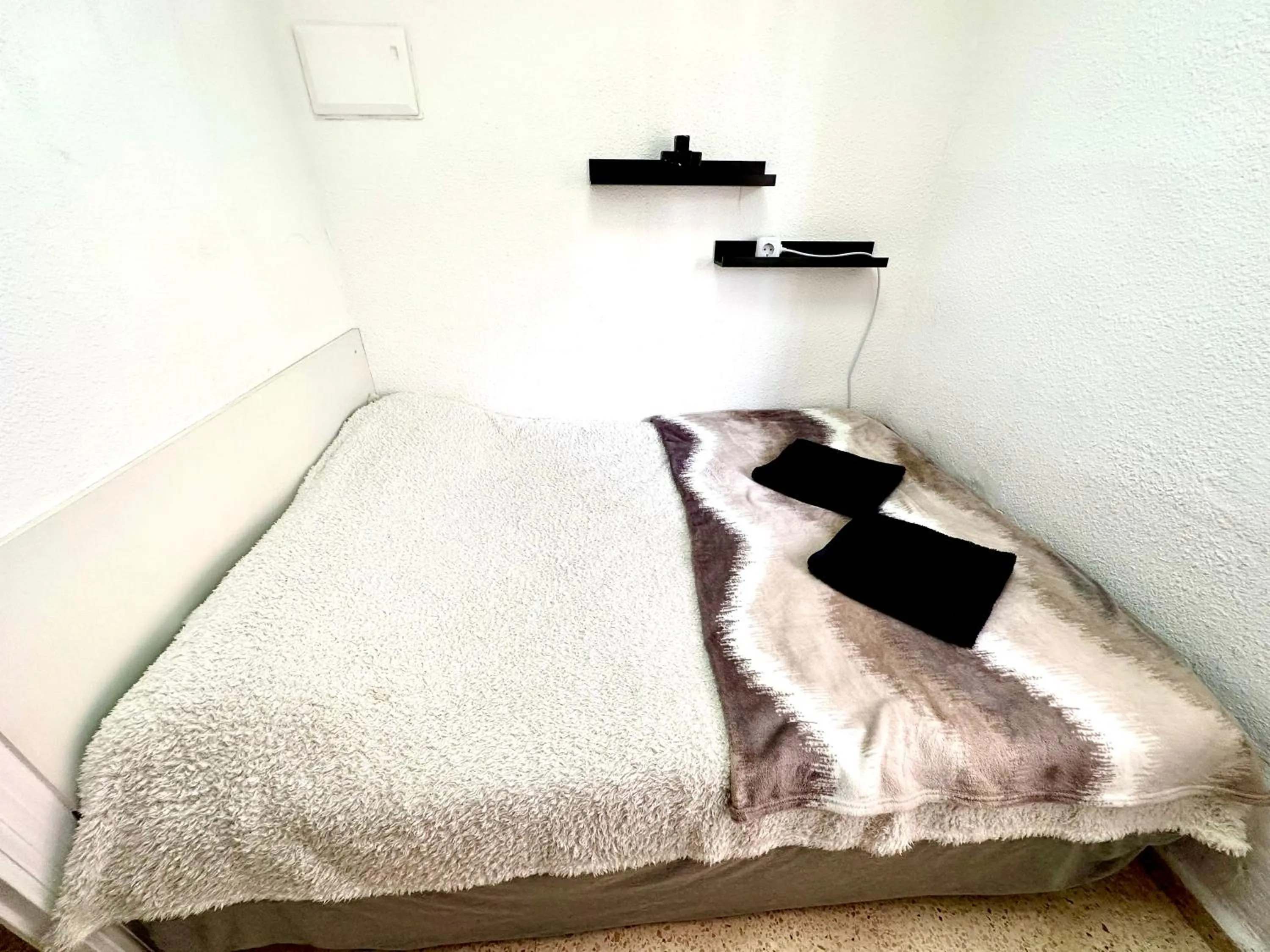 Bed in Las habitaciones en Alicante