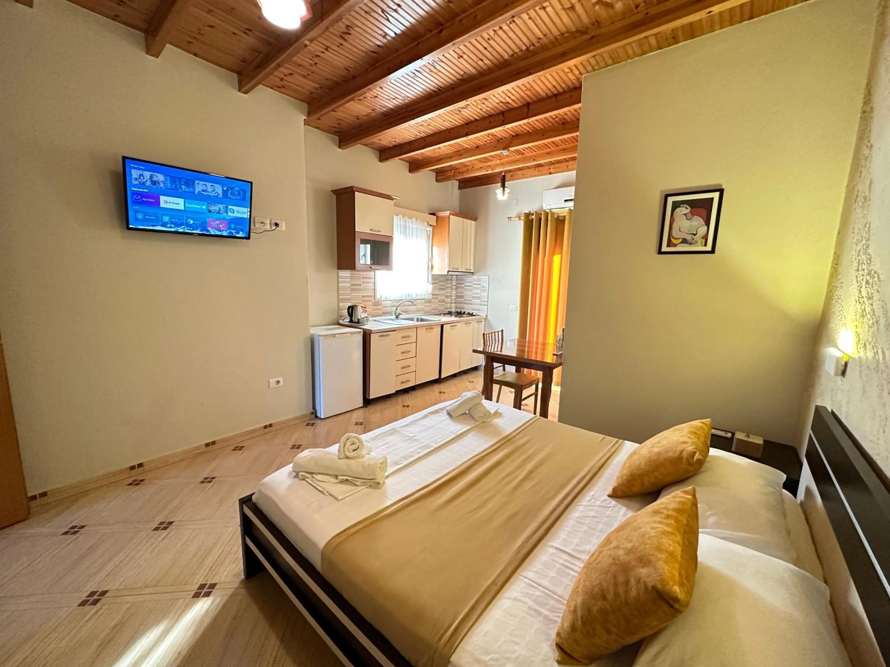 Communal lounge/ TV room, Bed in Vila Arial