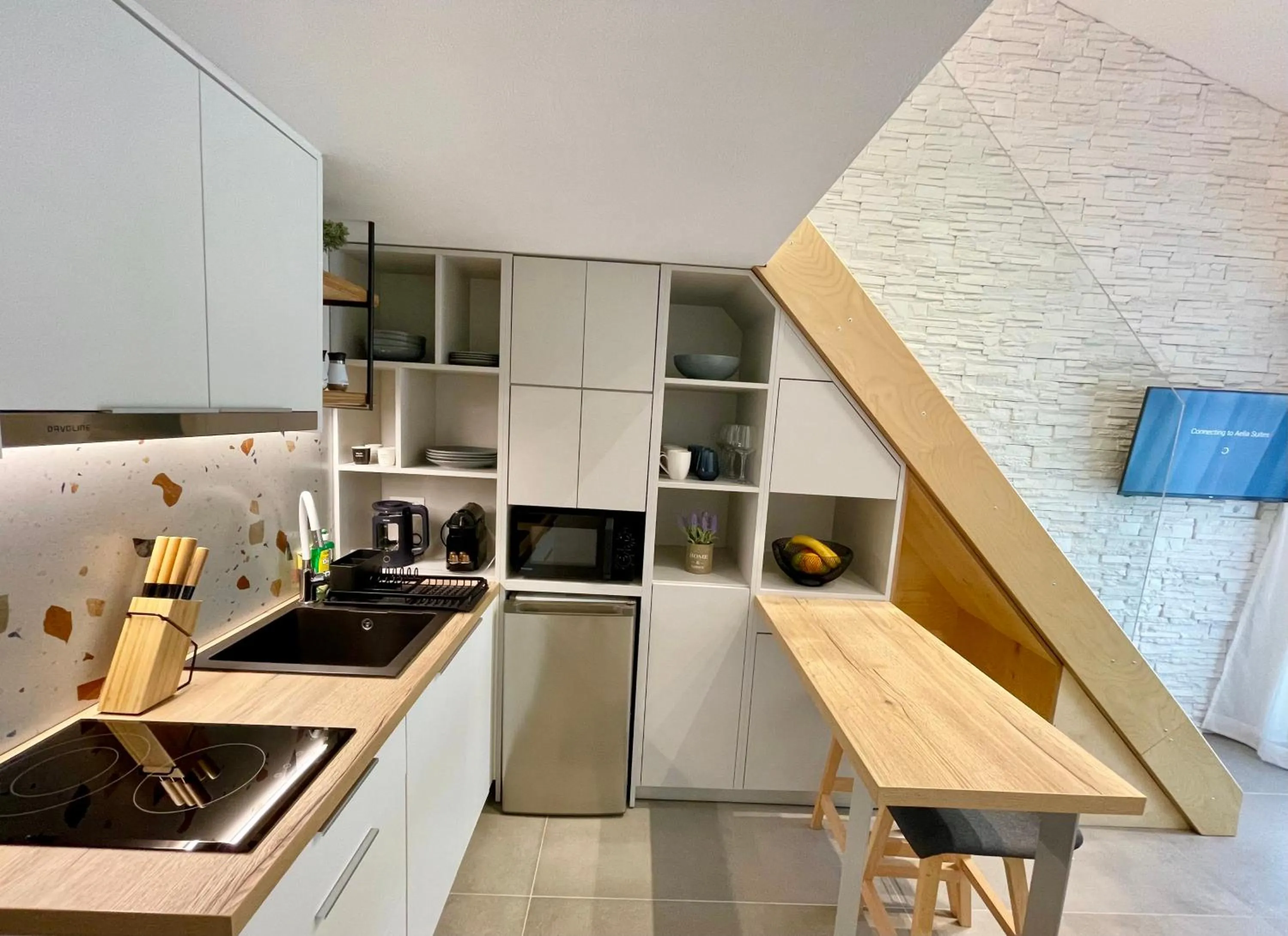 Kitchen or kitchenette in Aelia Suites