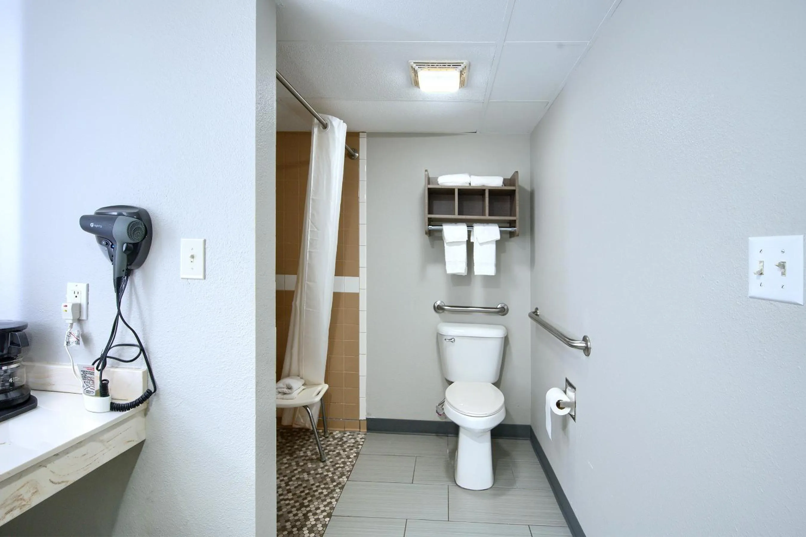 Toilet in Hot Springs Village Inn