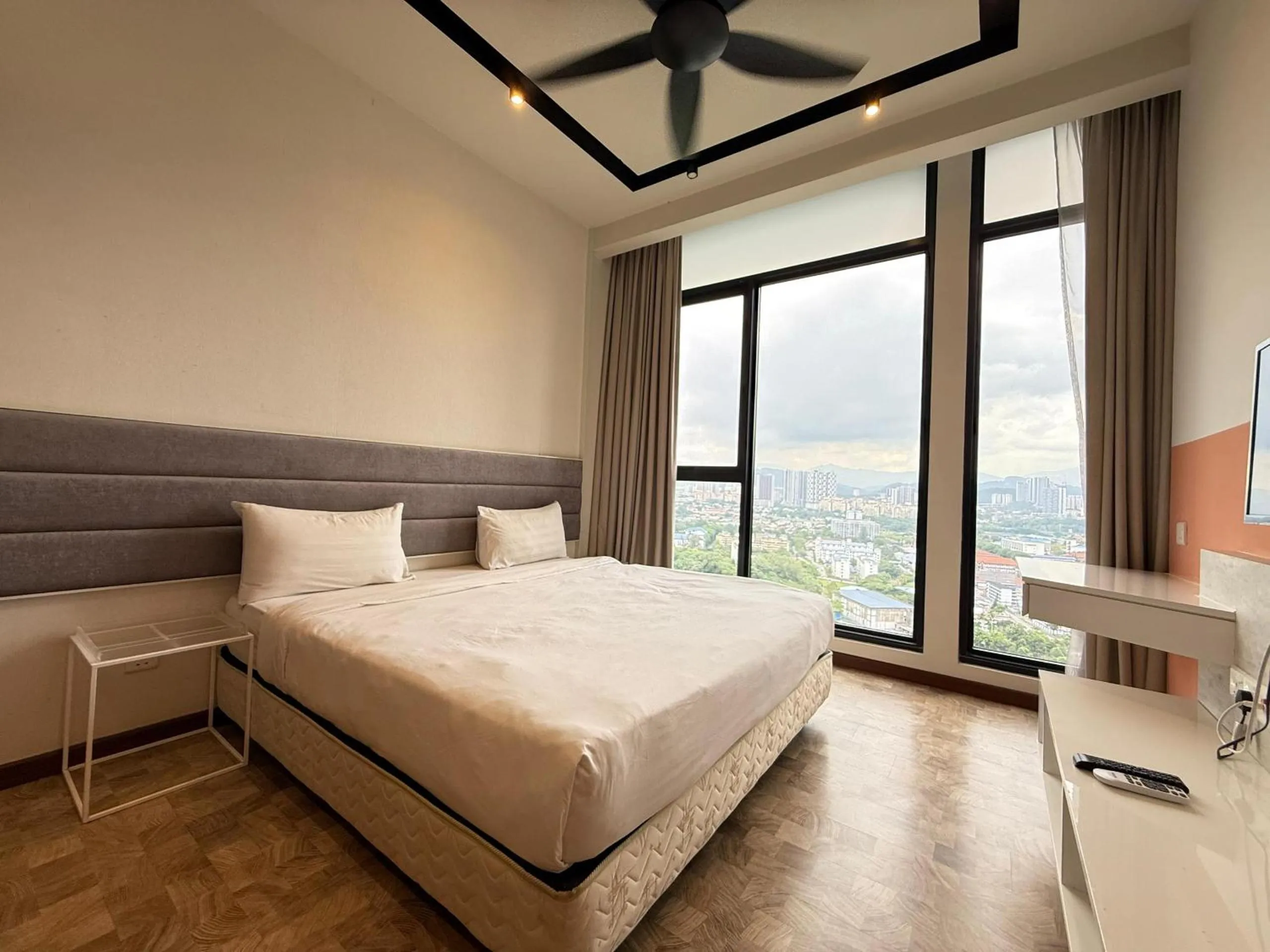 Bed in Expressionz Professional Suites by AURORA SUMMER SUITES