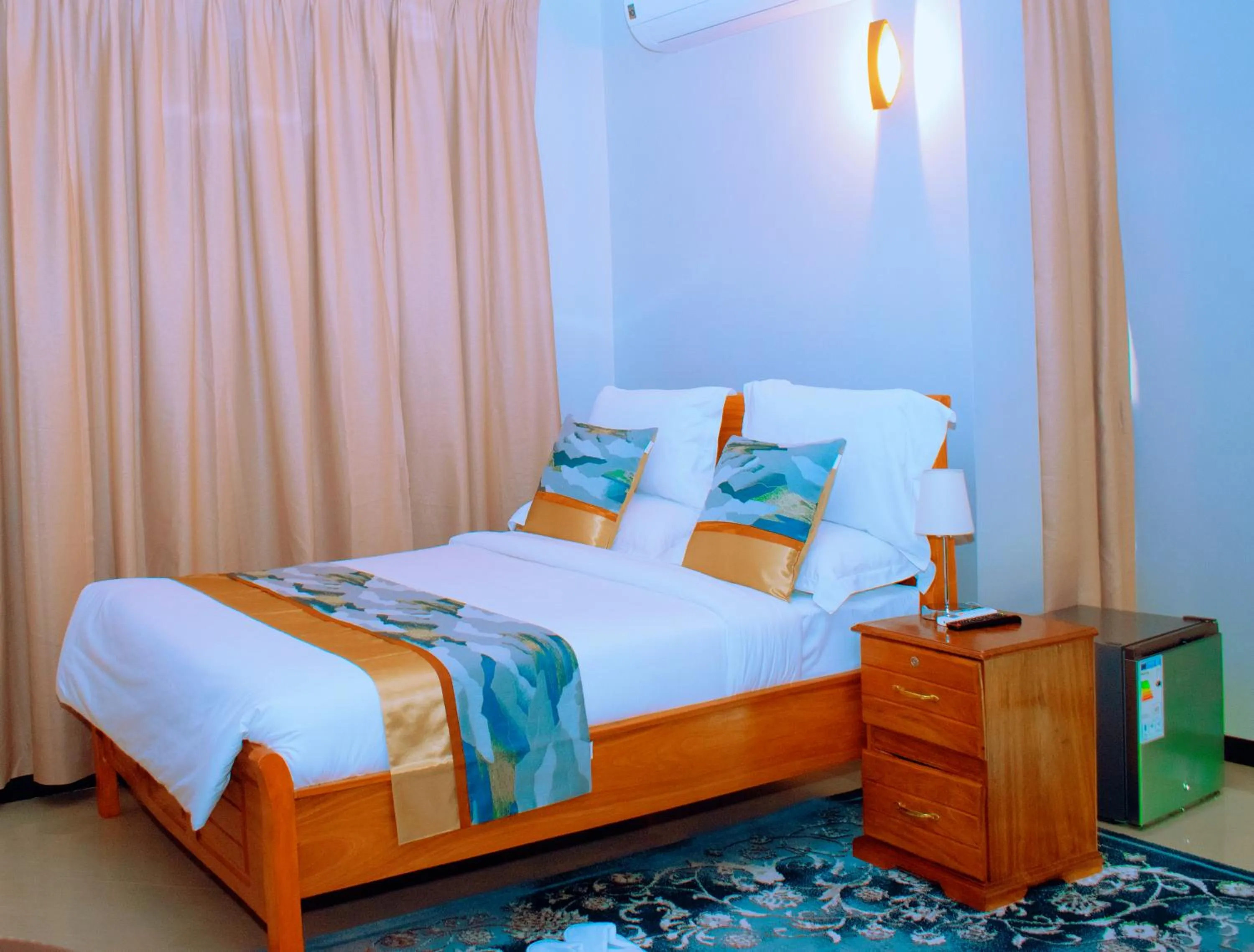 Bed in Inoga Luxury Hotel