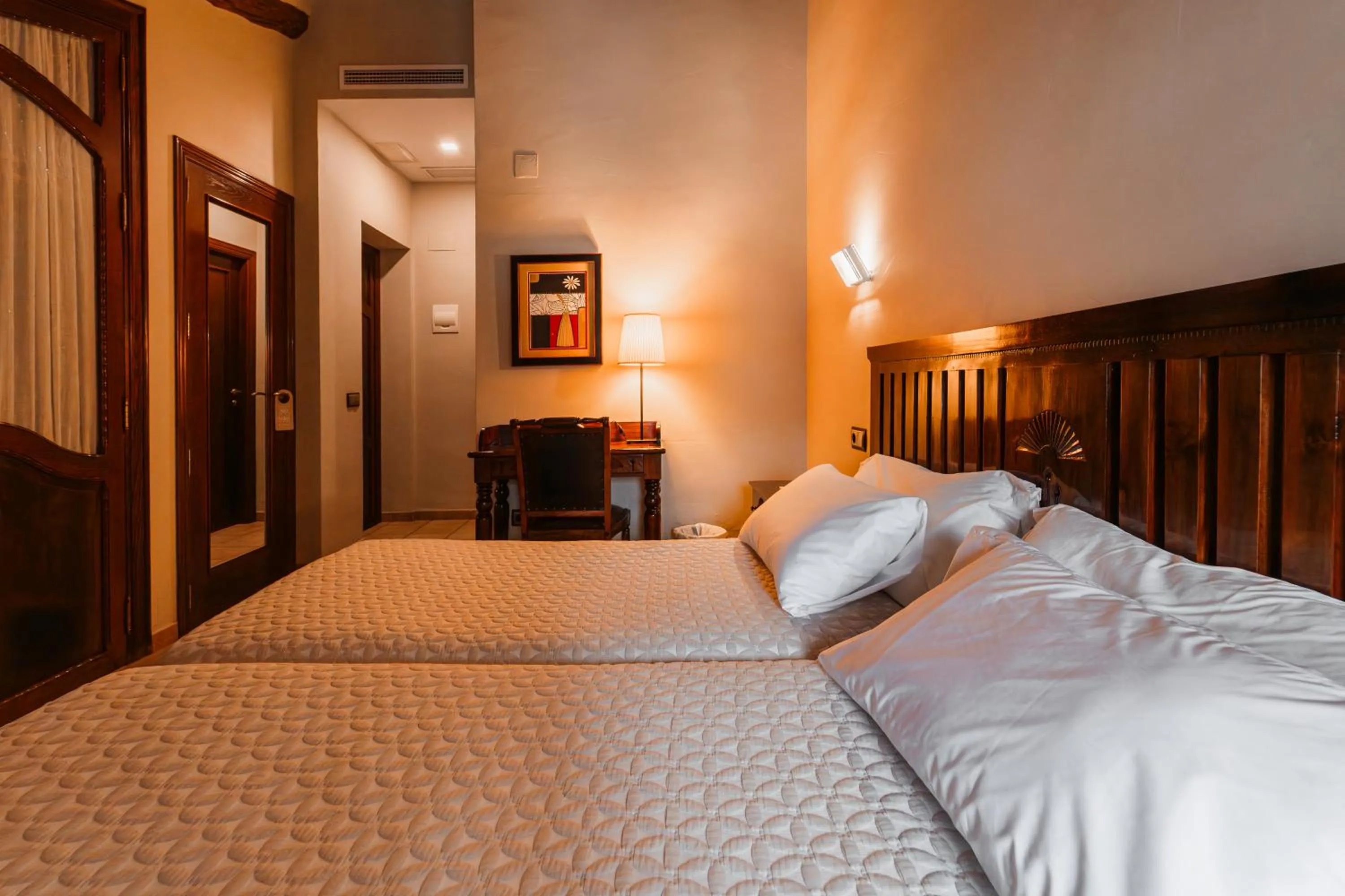 Bed in L'Agora Hotel