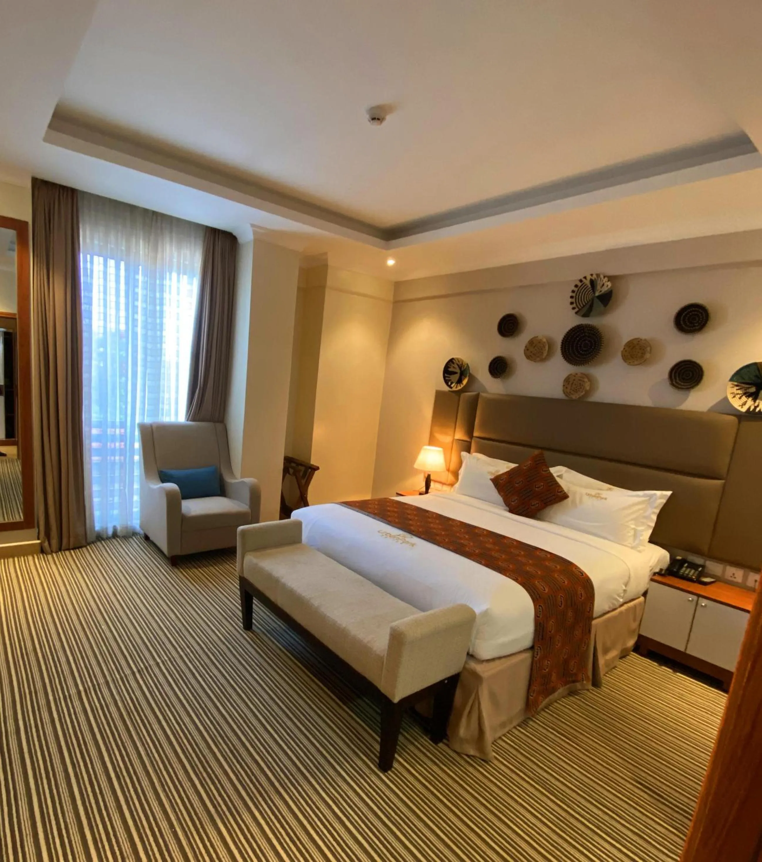 Decorative detail, Bed in Urban Park Suites Hotel