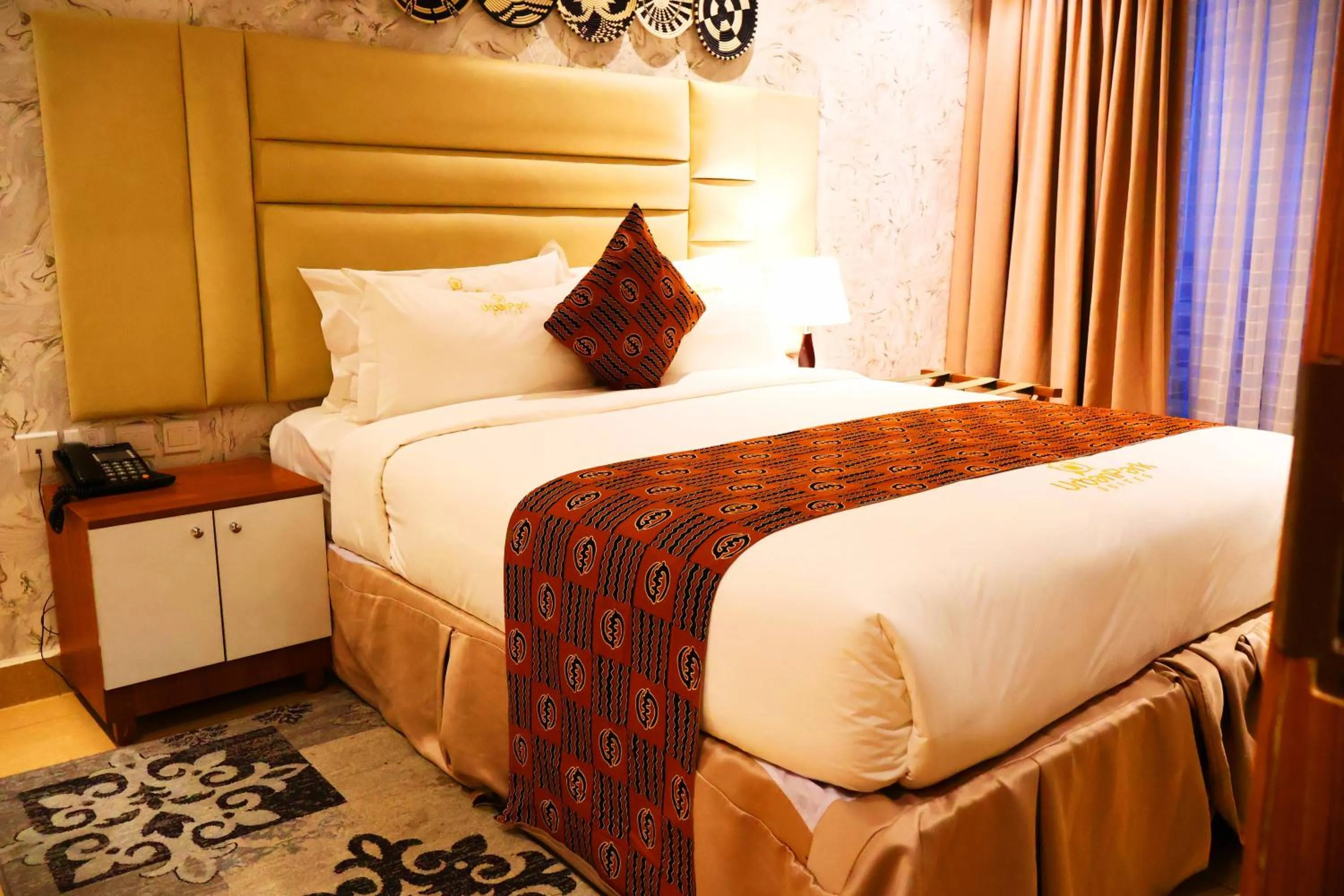 Bed in Urban Park Suites Hotel