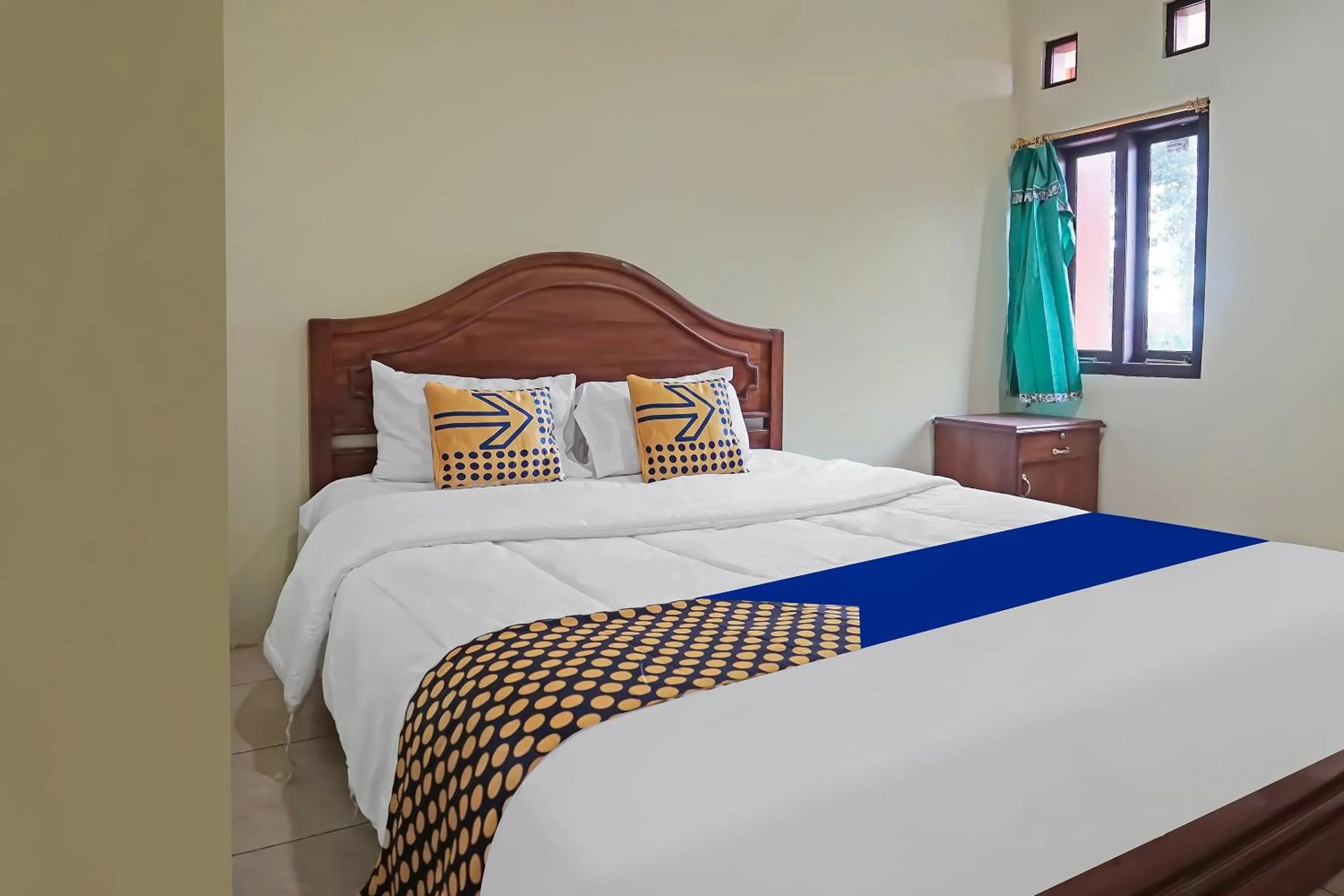 Bedroom in Hotel O Arfan HouseNearDanau Ranau