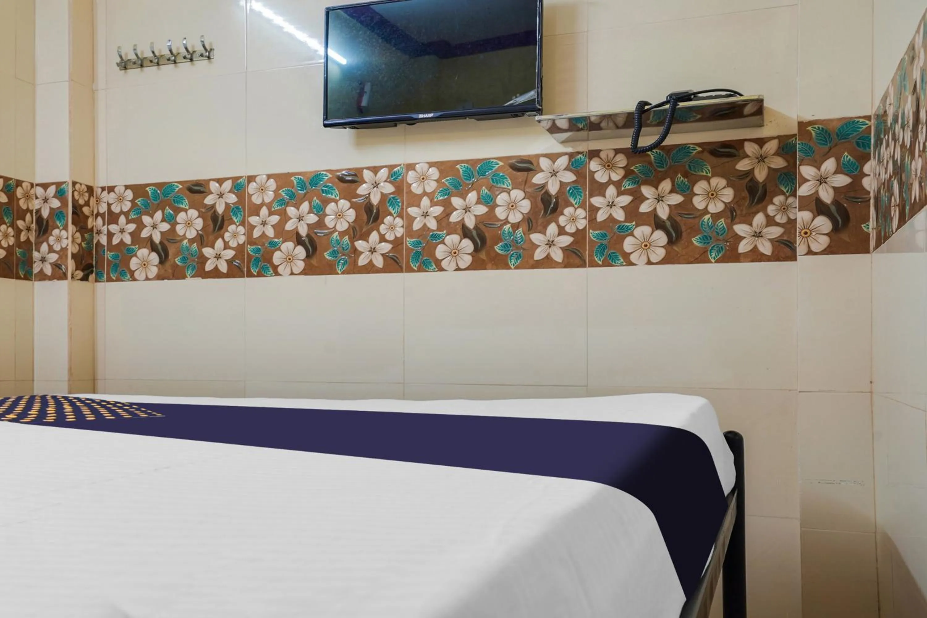 Bedroom in SPOT ON New ROYAL LODGE