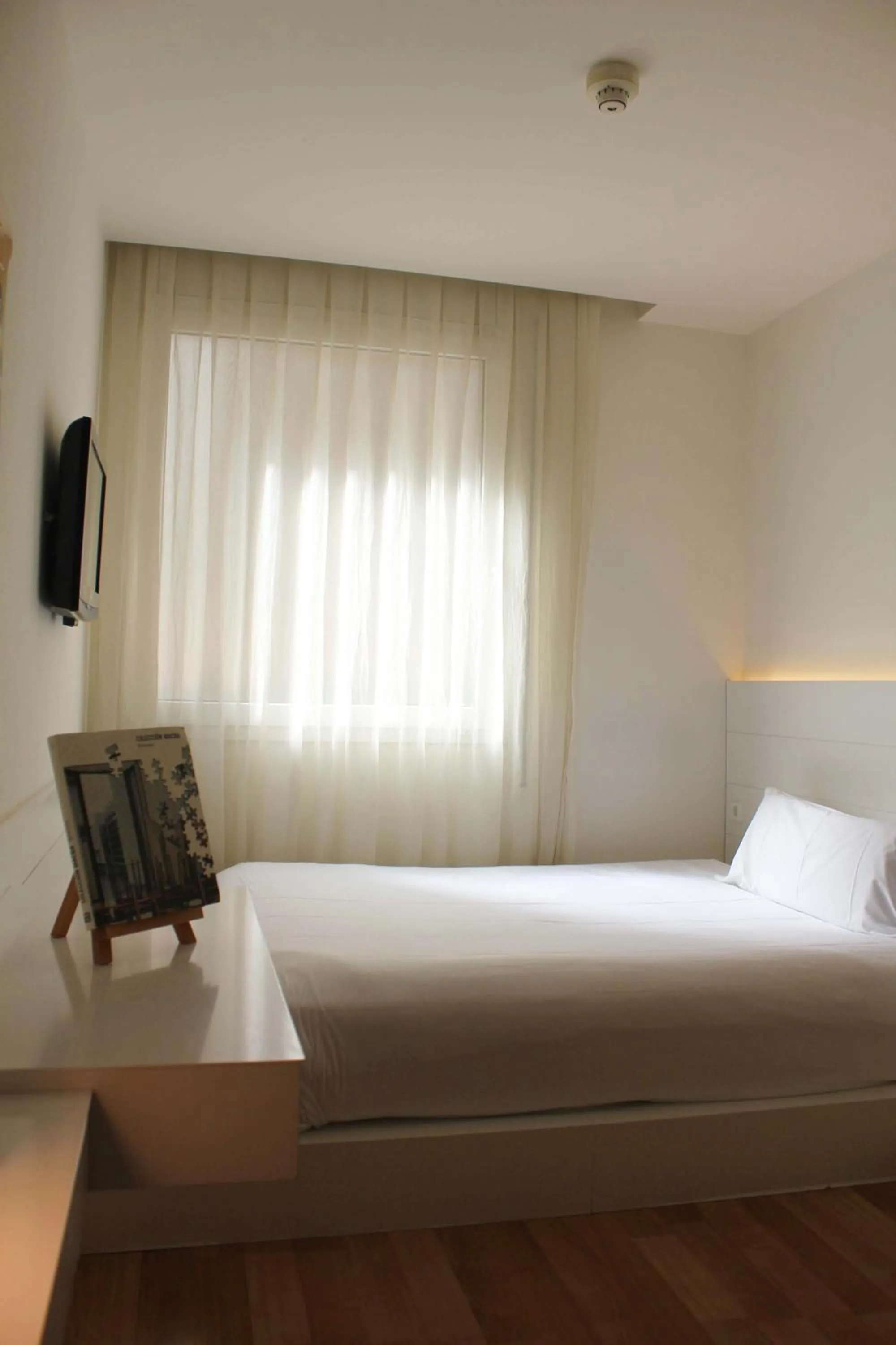 Bed in Pol & Grace Hotel