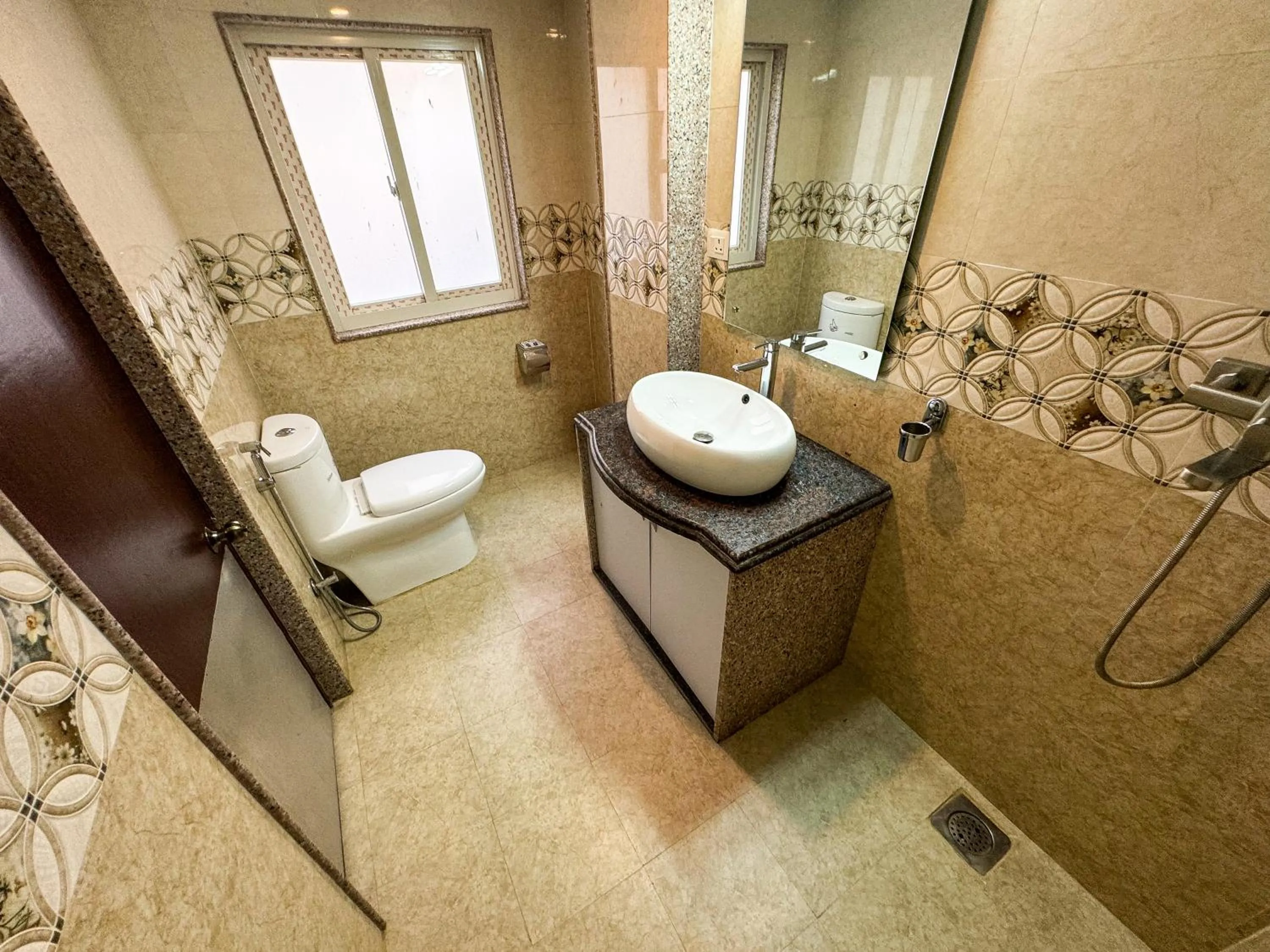 Bathroom in Hotel Abi International