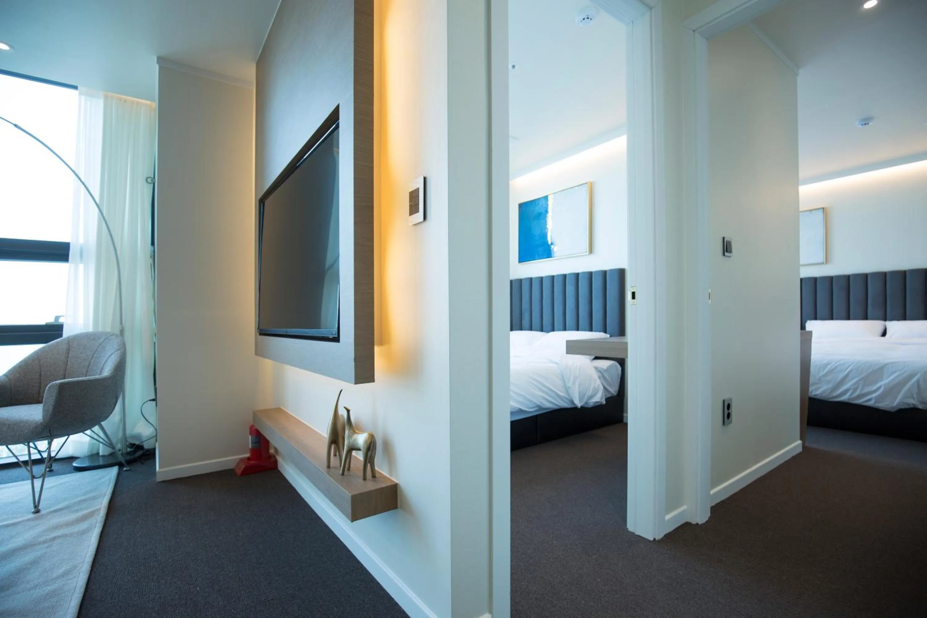 Living room, Bed in UH Suite The Haeundae