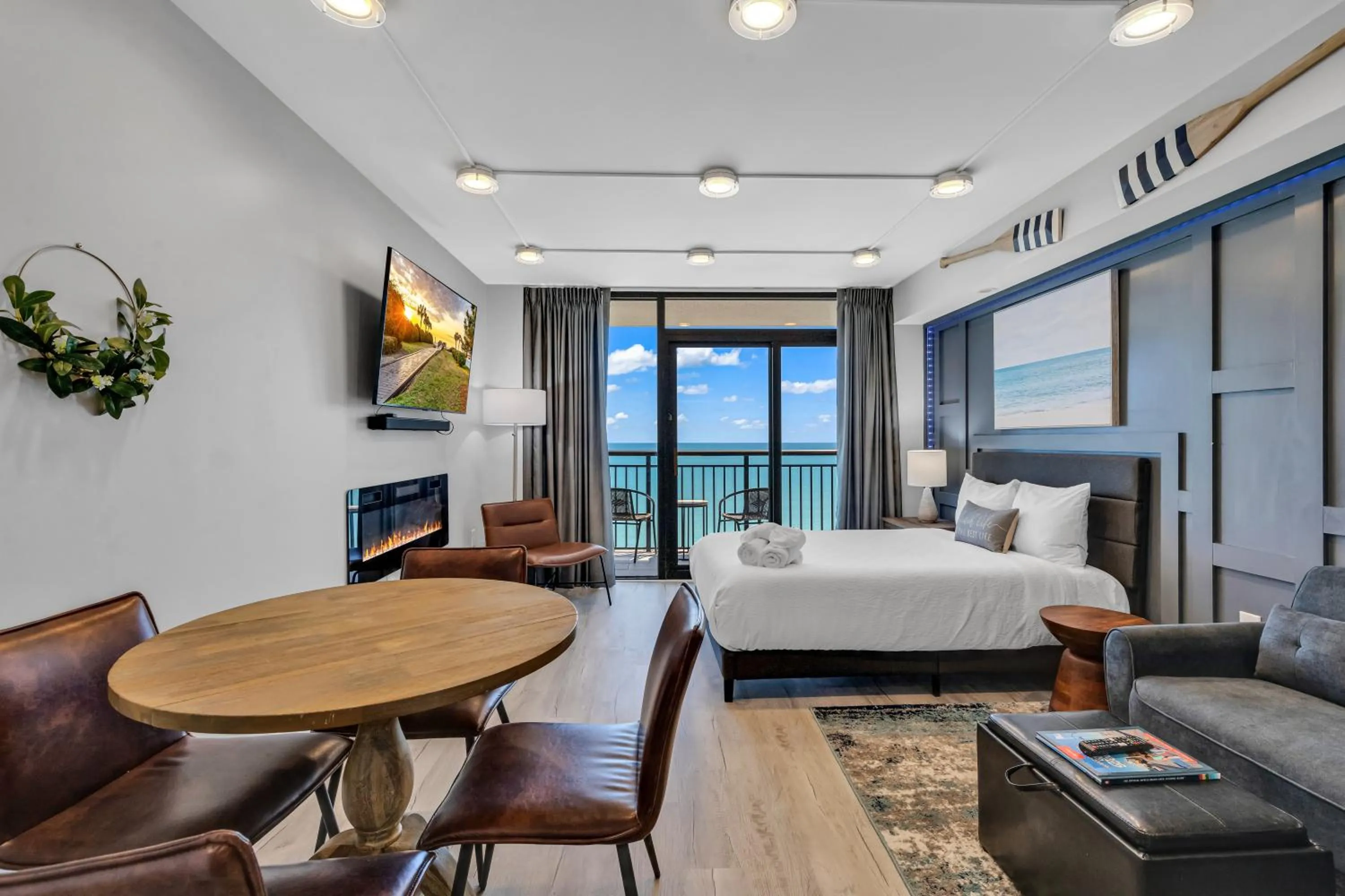 Living room, Bed in Breakers Tower 1BR Oceanfront Condo