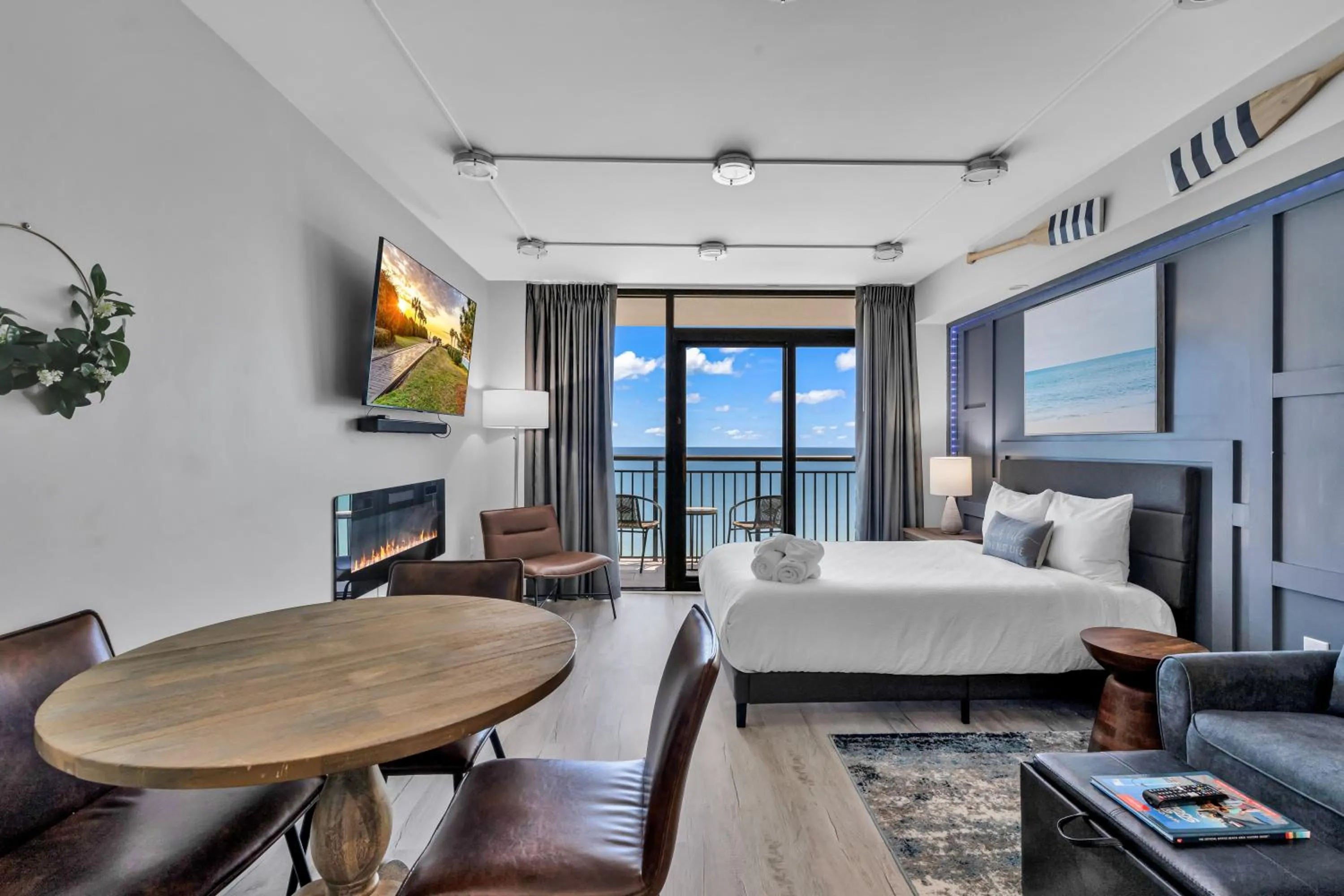 Living room, Bed in Breakers Tower 1BR Oceanfront Condo