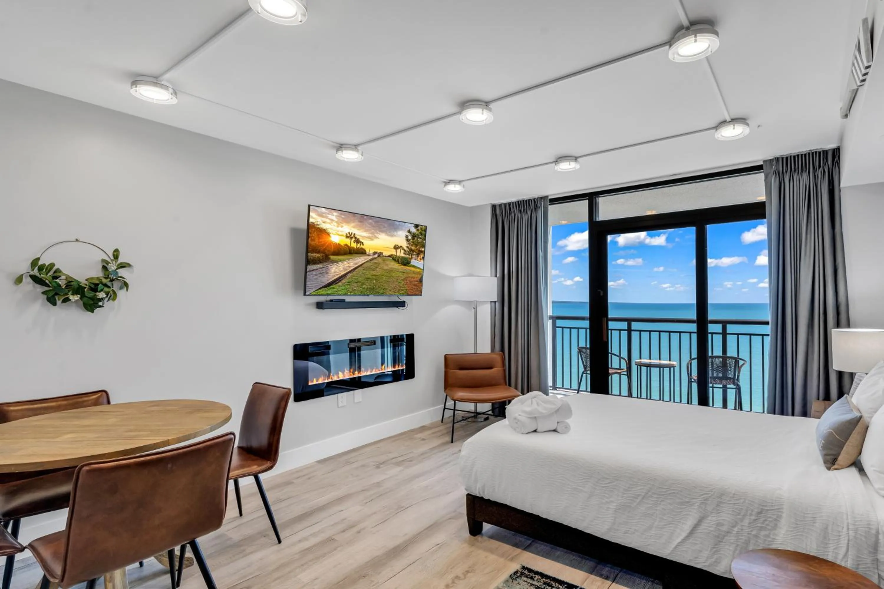 Living room, Bed in Breakers Tower 1BR Oceanfront Condo