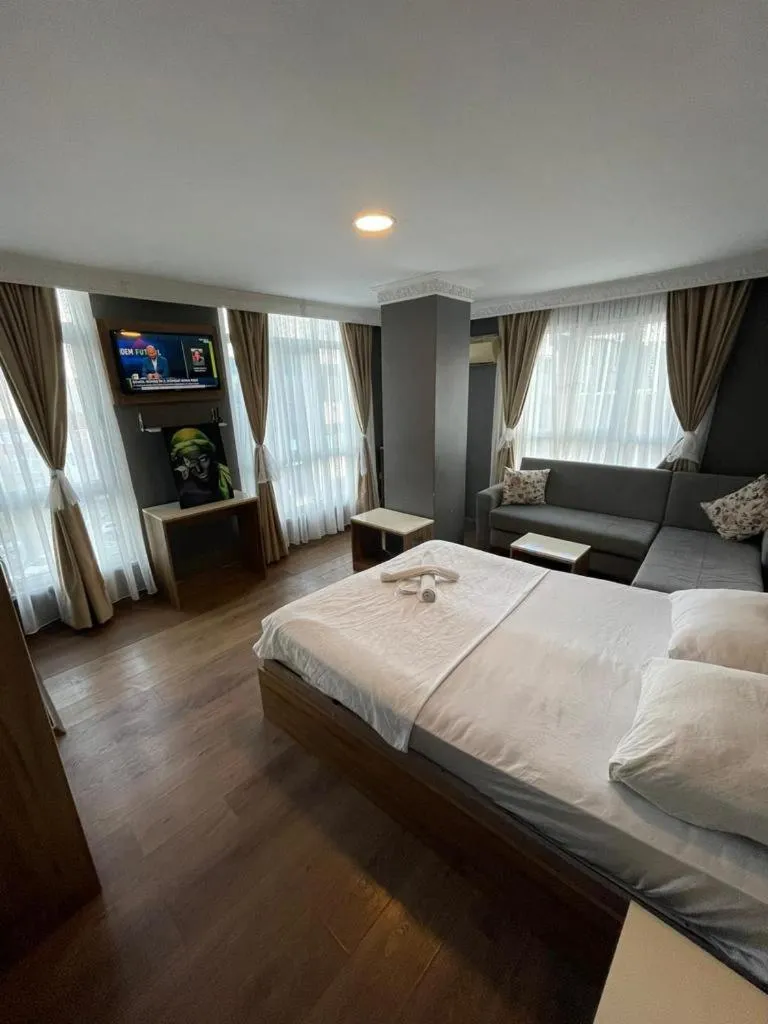 Bed in CAMELLİA SUİT HOTEL