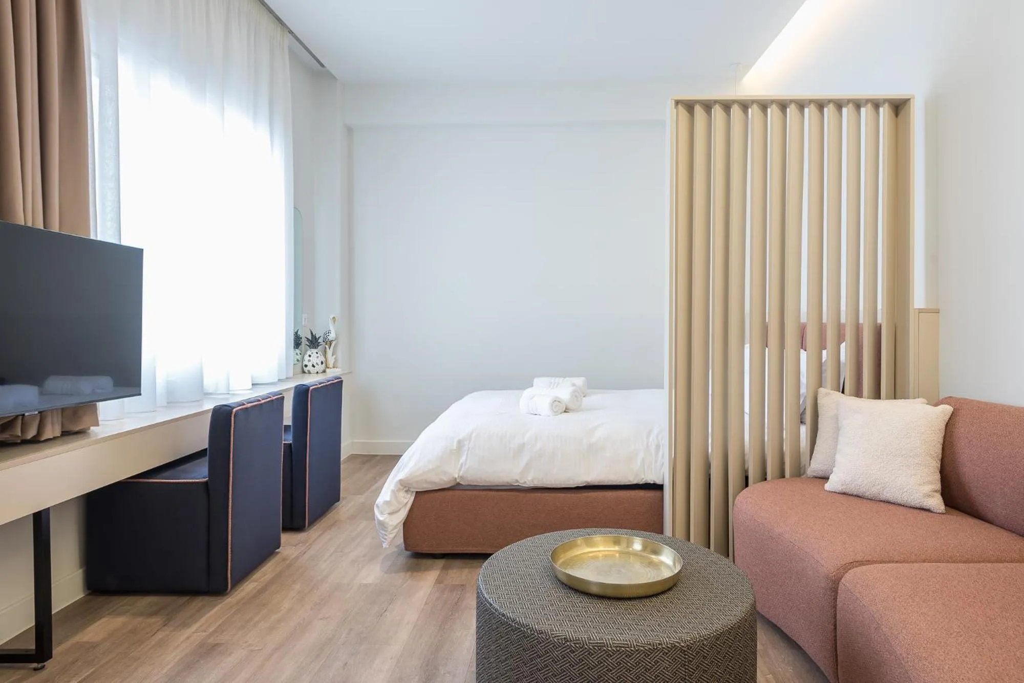 Seating area, Bed in Aeiphoria Suites & Rooms - Athens