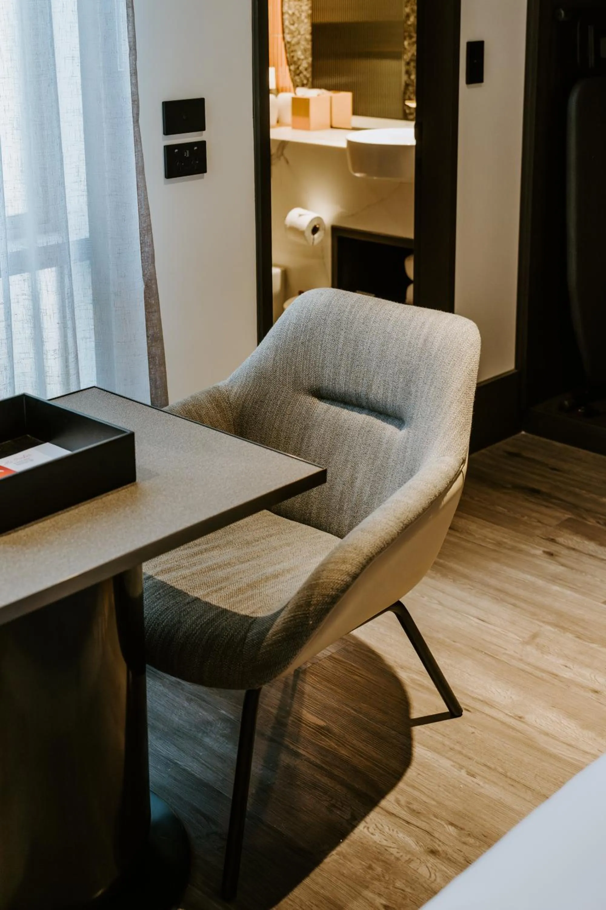 Living room in The Motley Hotel Richmond, Tapestry Collection by Hilton