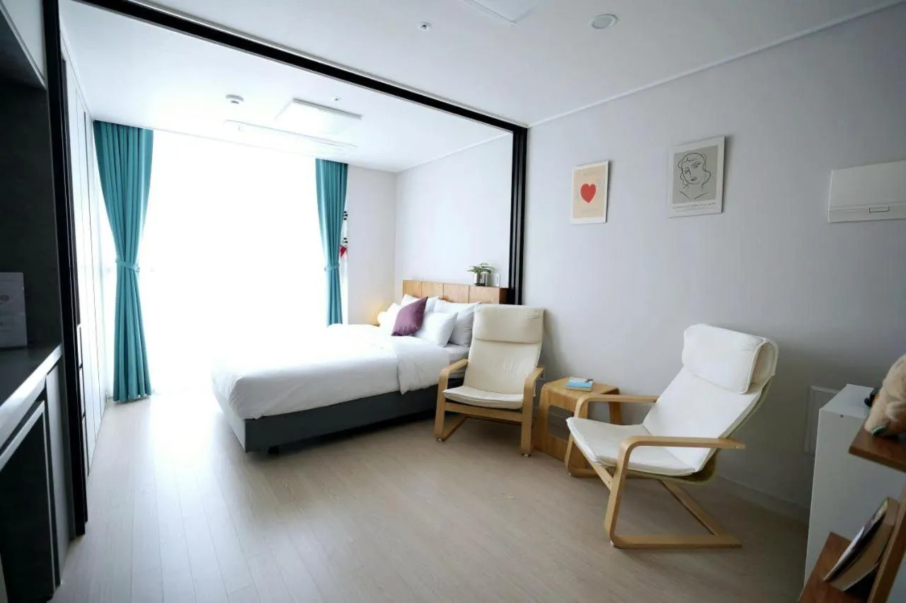 Living room, Bed in Wellstay hotel Incheon