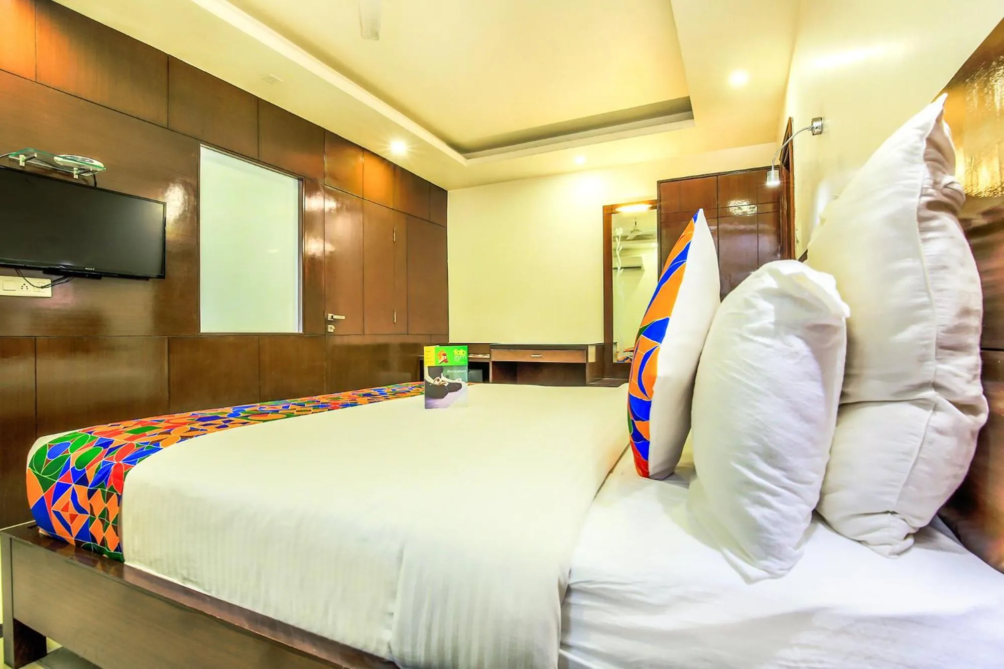 Bed in FabHotel Tipsyy Inn Suites