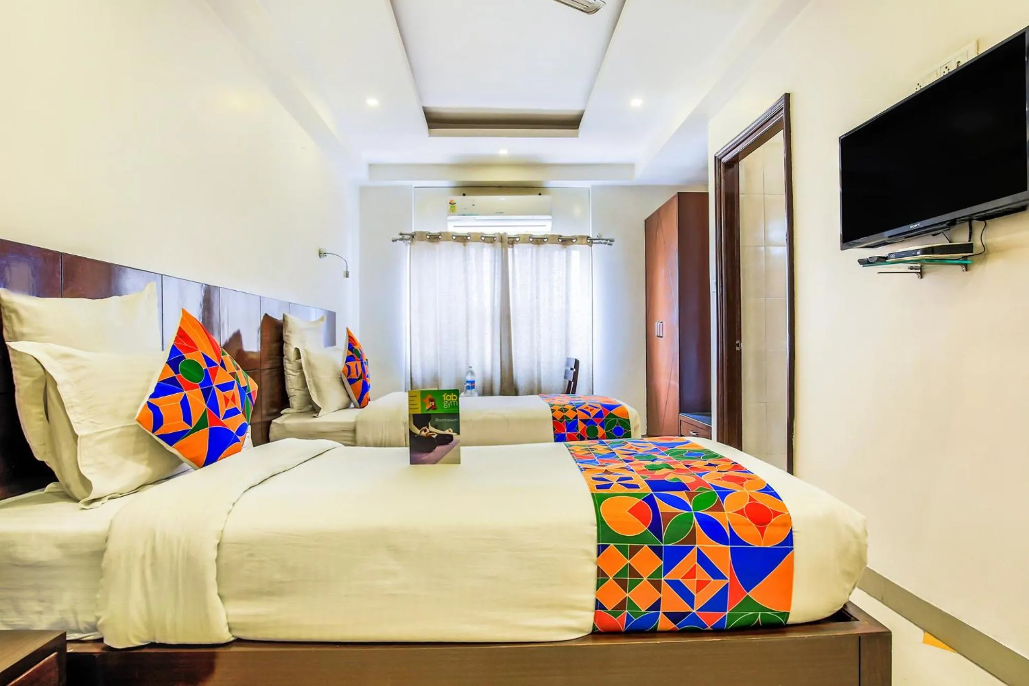 Bed in FabHotel Tipsyy Inn Suites