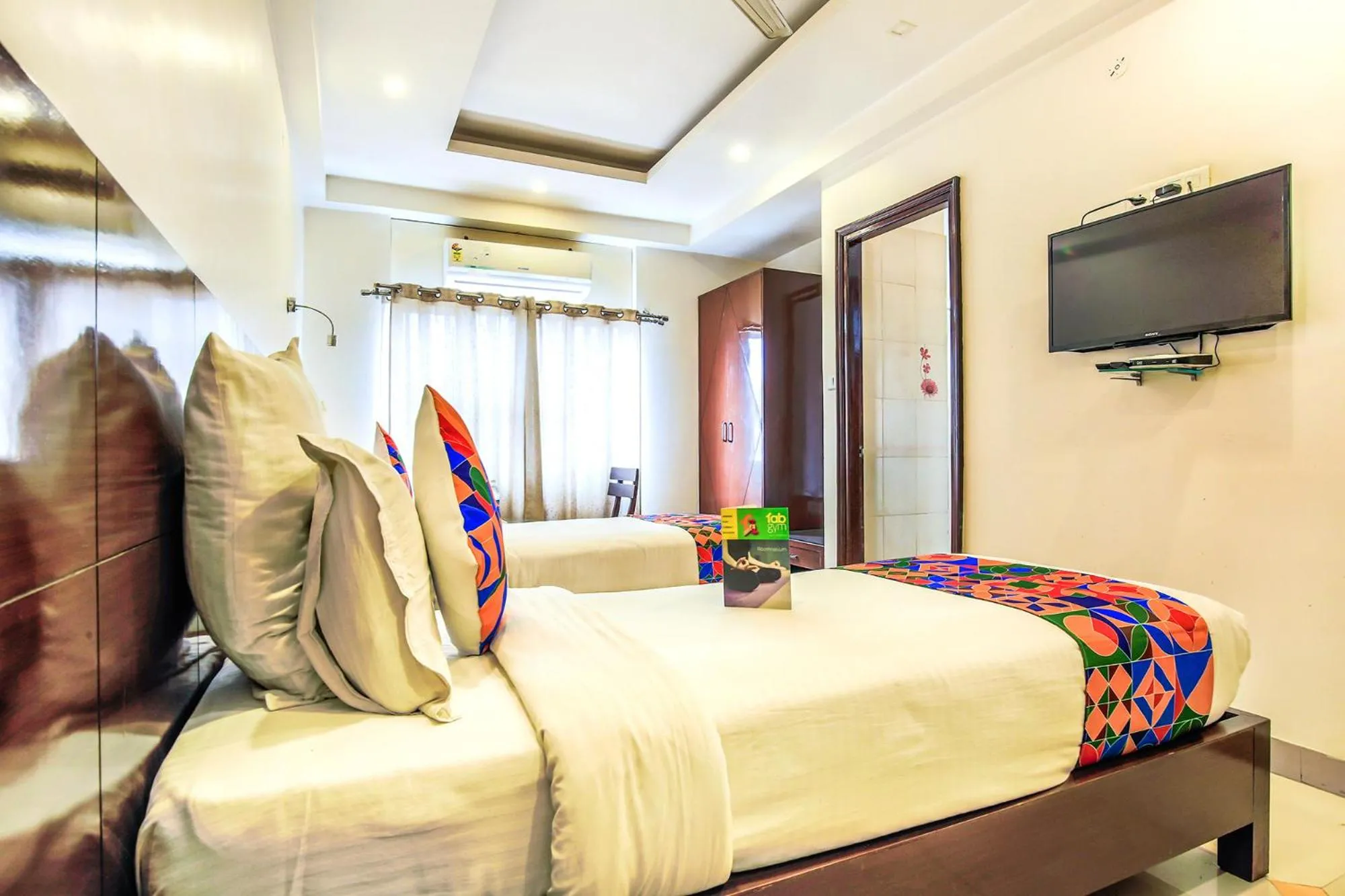 Bed in FabHotel Tipsyy Inn Suites