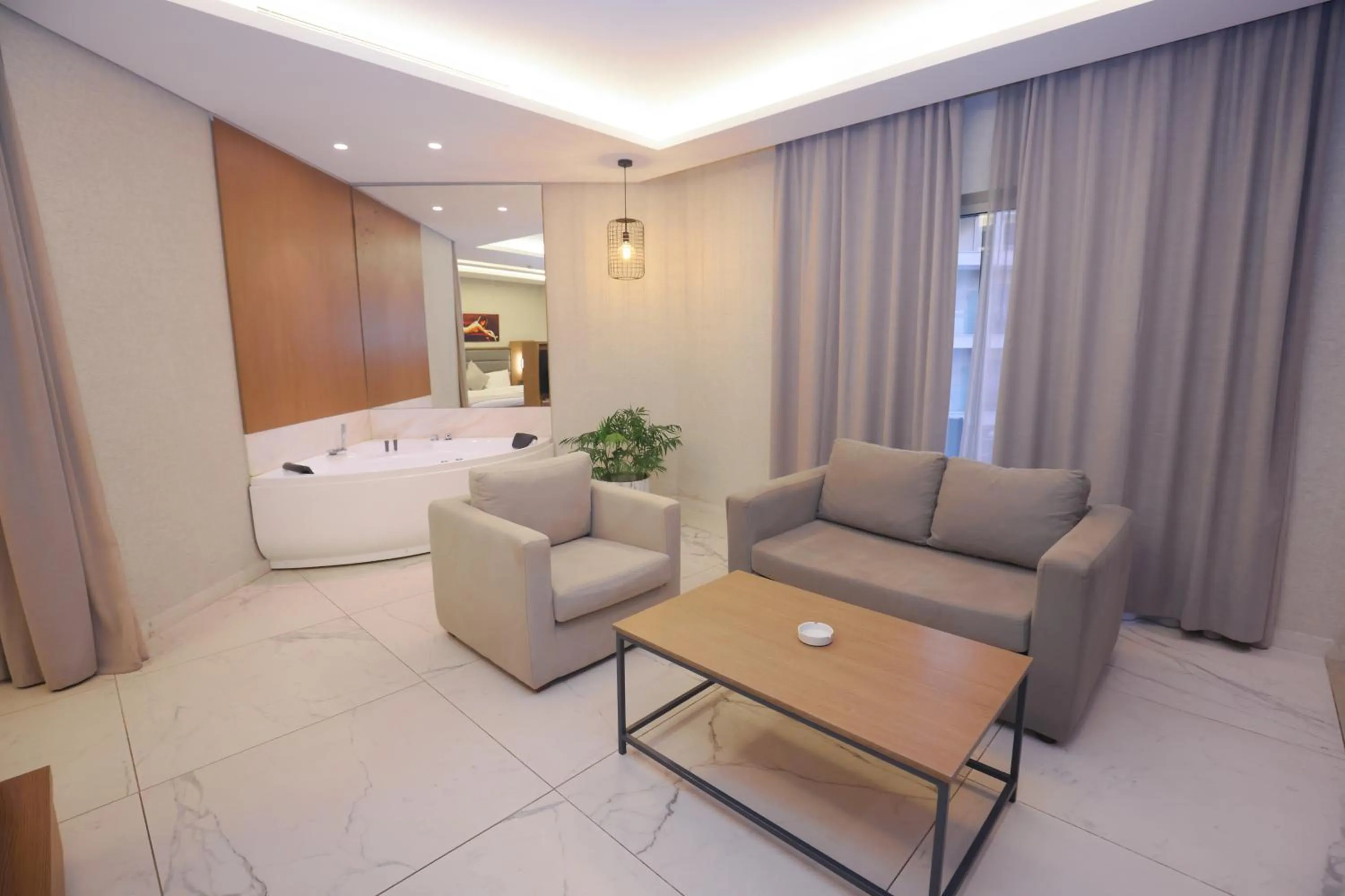 Seating area, Bed in Heaven Prestige Hotel