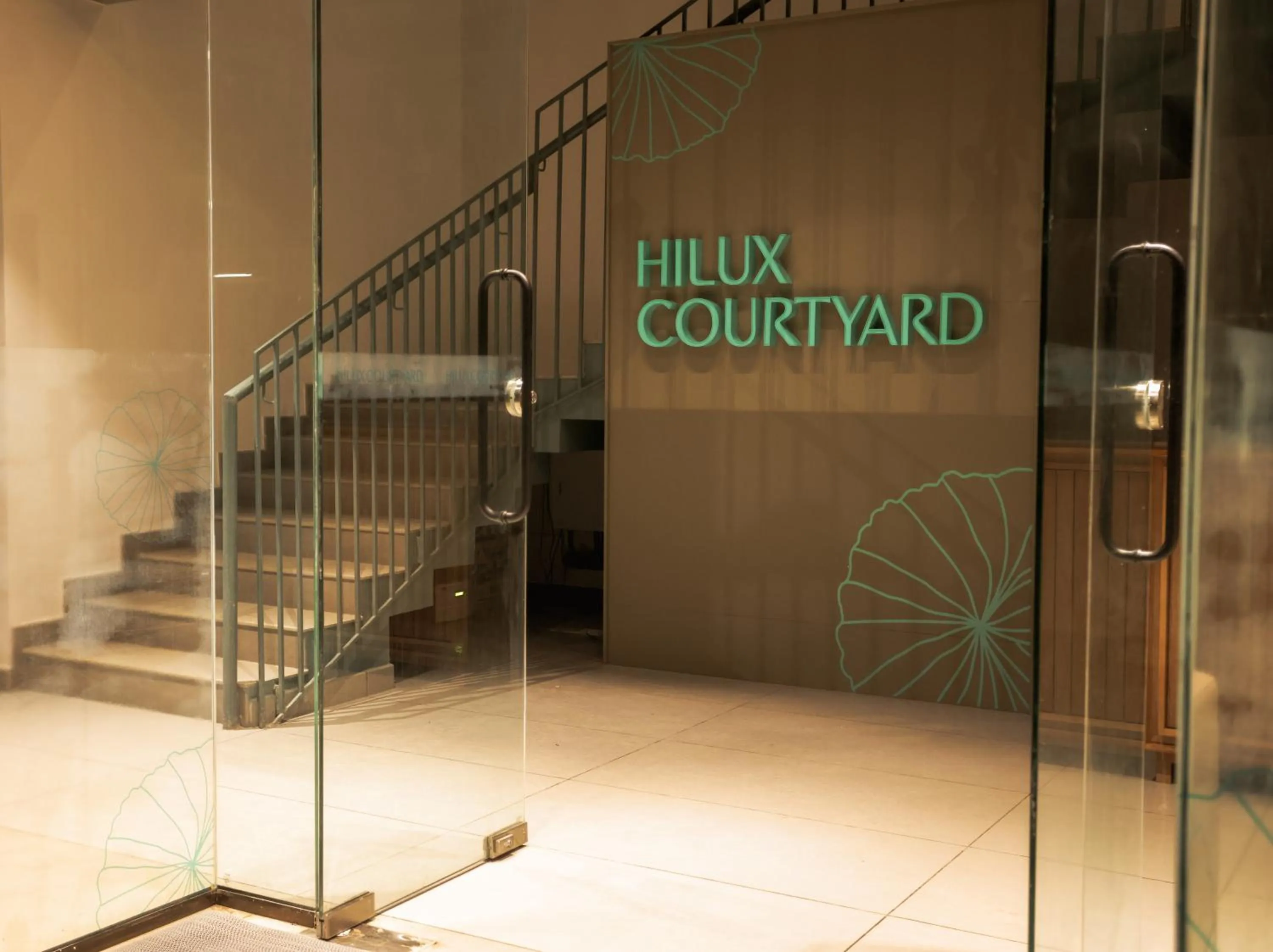 Property logo or sign in HILUX COURTYARD